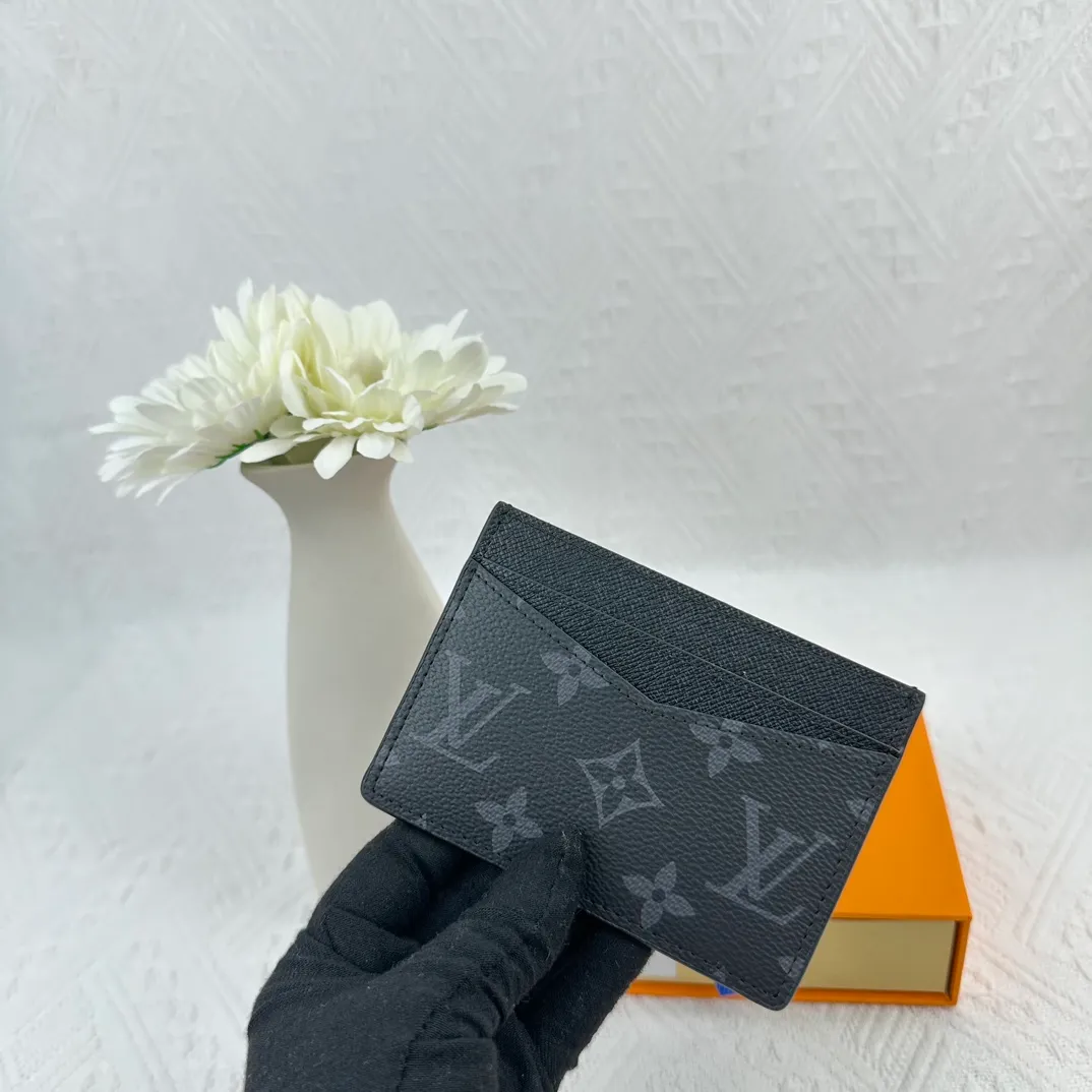 P66M60166 Card Holder Neo card holder made of Monogram Macassar canvas is the first choice for carrying important cards. Black leather trim makes the classic Louis Vuitton pattern even more eye-catching. Size: 7.5*12