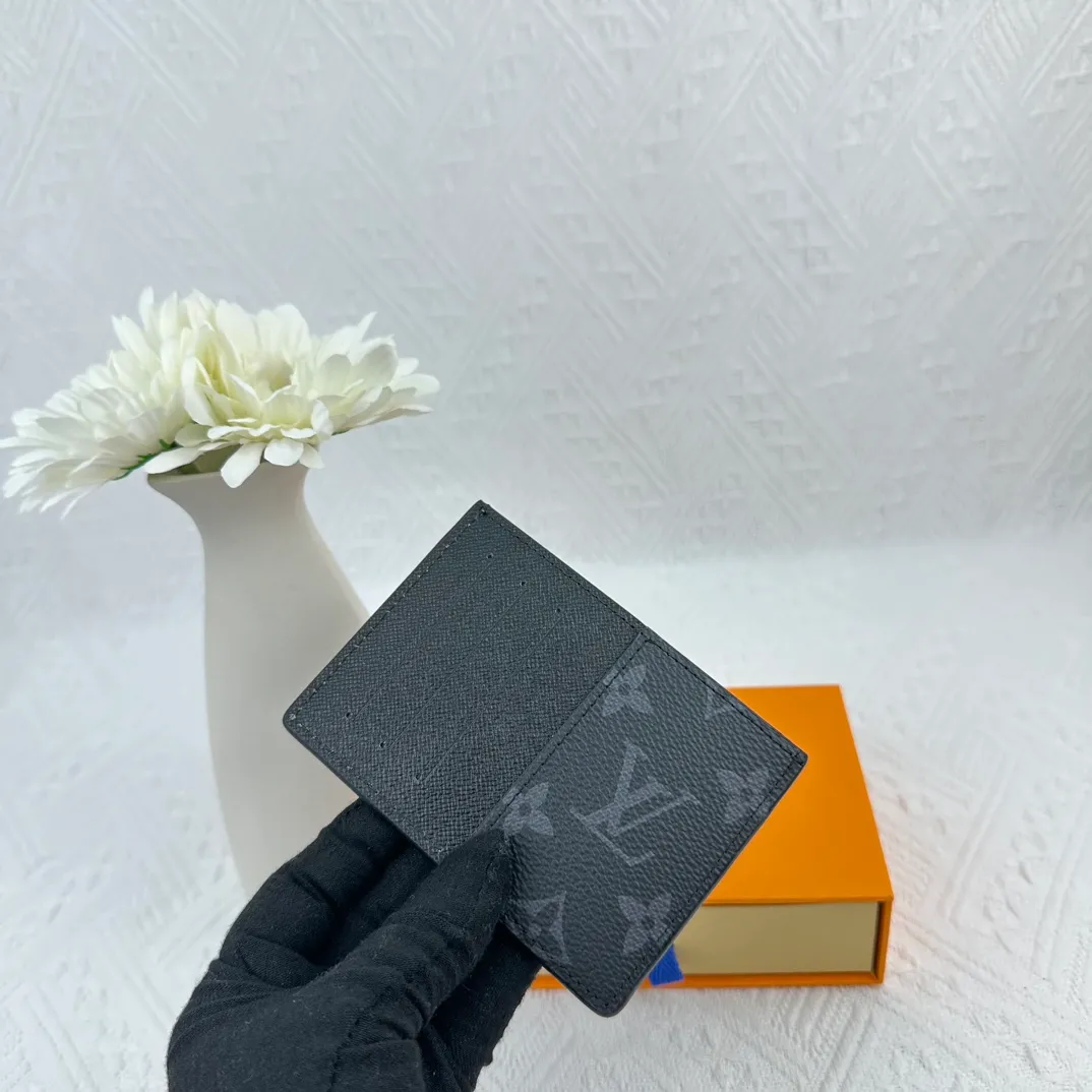 P66M60166 Card Holder Neo card holder made of Monogram Macassar canvas is the first choice for carrying important cards. Black leather trim makes the classic Louis Vuitton pattern even more eye-catching. Size: 7.5*12