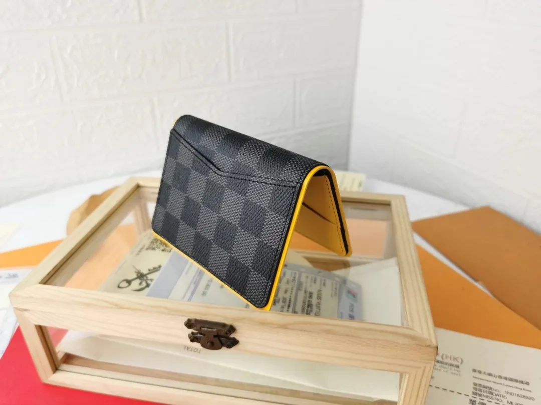 P110💰Top Original💎N63144 black check with yellow, this pocket wallet combines the elegance of Damier Graphite canvas with the delicate texture of Epi leather, with stripes emblazoned with the Louis Vuitton logo. The elegant design can accommodate credit cards, banknotes and receipts, making it suitable for daily carrying or gift giving. Detailed Features 8.0 x 11.0 x 1.0 cm (L x H x W) Epi leather and Damier Graphite coated canvas Coated cowhide leather trim Cowhide lining, card compartment, inner pocket, outer patch pocket This product is made in one of France, Spain, Italy and the United States