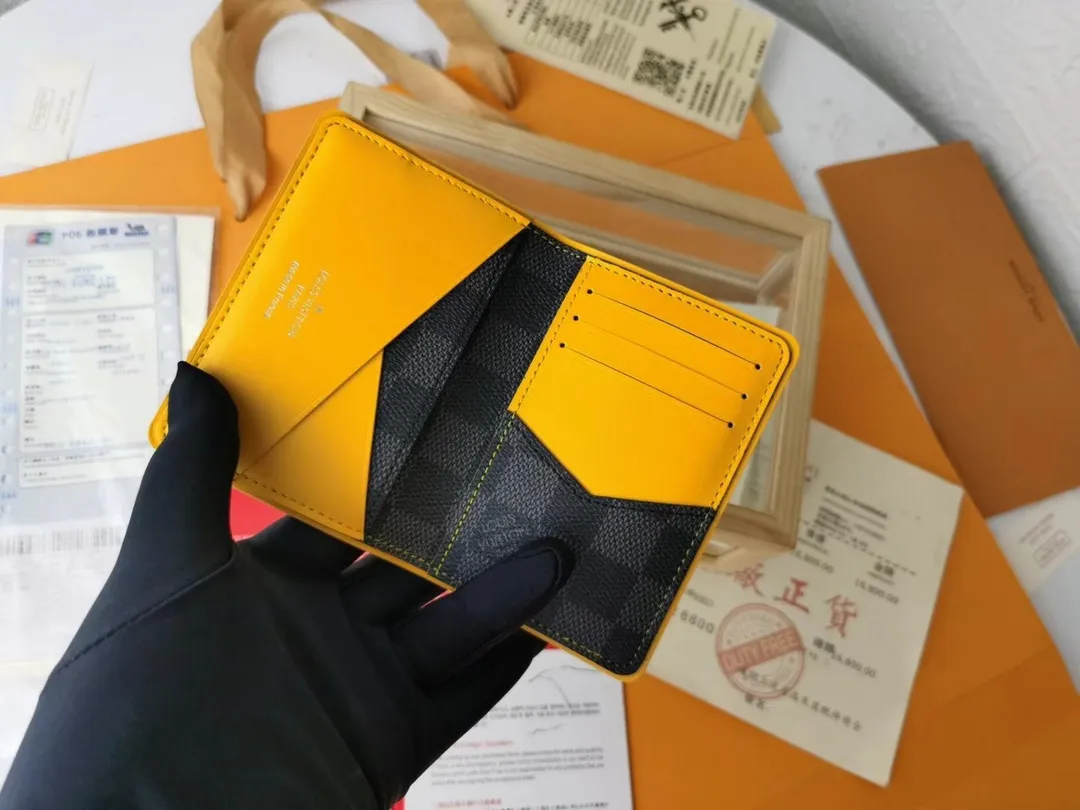 P110💰Top Original💎N63144 black check with yellow, this pocket wallet combines the elegance of Damier Graphite canvas with the delicate texture of Epi leather, with stripes emblazoned with the Louis Vuitton logo. The elegant design can accommodate credit cards, banknotes and receipts, making it suitable for daily carrying or gift giving. Detailed Features 8.0 x 11.0 x 1.0 cm (L x H x W) Epi leather and Damier Graphite coated canvas Coated cowhide leather trim Cowhide lining, card compartment, inner pocket, outer patch pocket This product is made in one of France, Spain, Italy and the United States