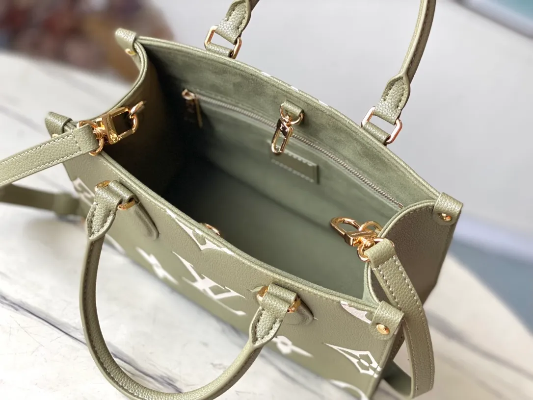 💰1040 (top layer leather) top original order M46569 new grass green This OnTheGo small handbag is made of Monogram Empreinte leather, with mild tones that set off the LV letters and Monogram flower embossing, making the compact and square shape shimmer. The rolled top handle and detachable shoulder strap make it easy to carry small items like your iPad Mini. Dimensions: 25 x 19 x 11.5 cm