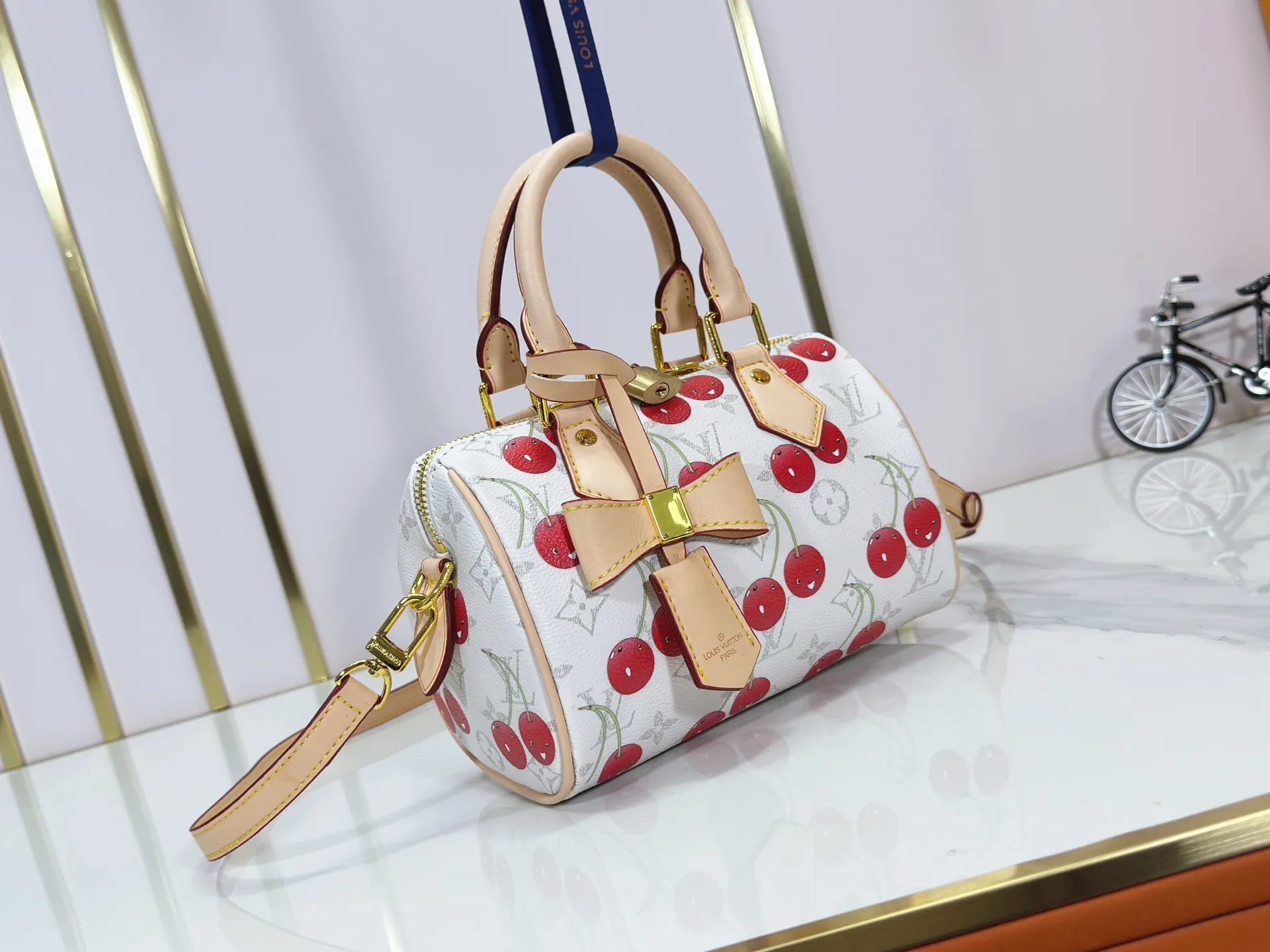 P240 Upgraded Original M14238 Louis Vuitton lv Cherry Bag The reprinted vibrant signature of the Louis Vuitton x Murakami collection elevates the Speedy Bandoulière with a chic twist. A sweet cherry pattern enhances the house's signature Monogram coated canvas with a cheerful splash of color, while natural leather highlights the Toron top handle, removable strap and exclusive LV x TM keychain. It is crafted with proportions to carry everyday essentials both smart and long. Size:20.5x13.5x12