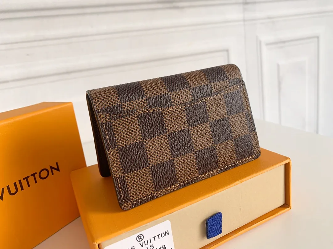 💰80 💎Small card holder Louis vuitton's pocket leather wallet has seven compartments, which can hold credit cards, bus cards, business cards, and even city maps. Damier canvas, leather-bound - two credit card compartments - four inner compartments - one outer compartment. ❤️ Model M63144 Size 7X11.