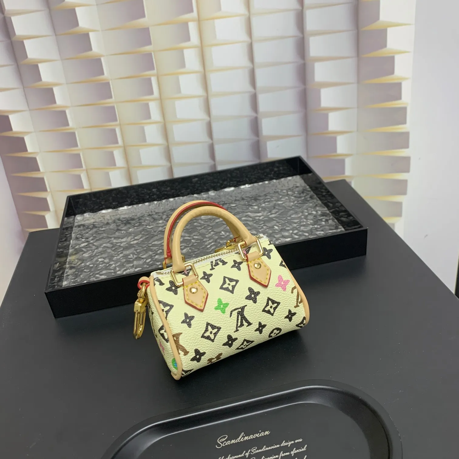 💰200 shipped😍 MINI KEEPALL bag charm and keychain ☀️Louis Vuitton Louis Vuitton lv mini pillow bag pendant ☀️This Mini Keepall bag charm and keychain condenses the classic handbag configuration, boldly showing the spirit of adventure. Monogram canvas with LV inscribed hook buckle, whether hung on a belt or handbag, its zipper closure and built-in keychain ensure secure storage