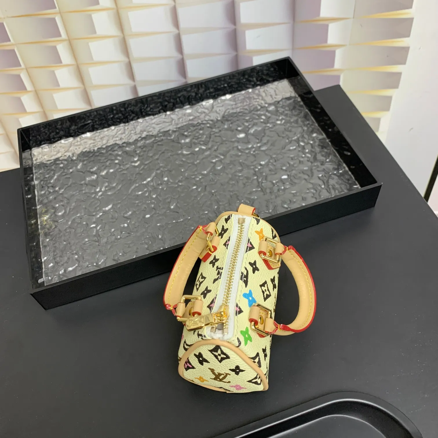 💰200 shipped😍 MINI KEEPALL bag charm and keychain ☀️Louis Vuitton Louis Vuitton lv mini pillow bag pendant ☀️This Mini Keepall bag charm and keychain condenses the classic handbag configuration, boldly showing the spirit of adventure. Monogram canvas with LV inscribed hook buckle, whether hung on a belt or handbag, its zipper closure and built-in keychain ensure secure storage