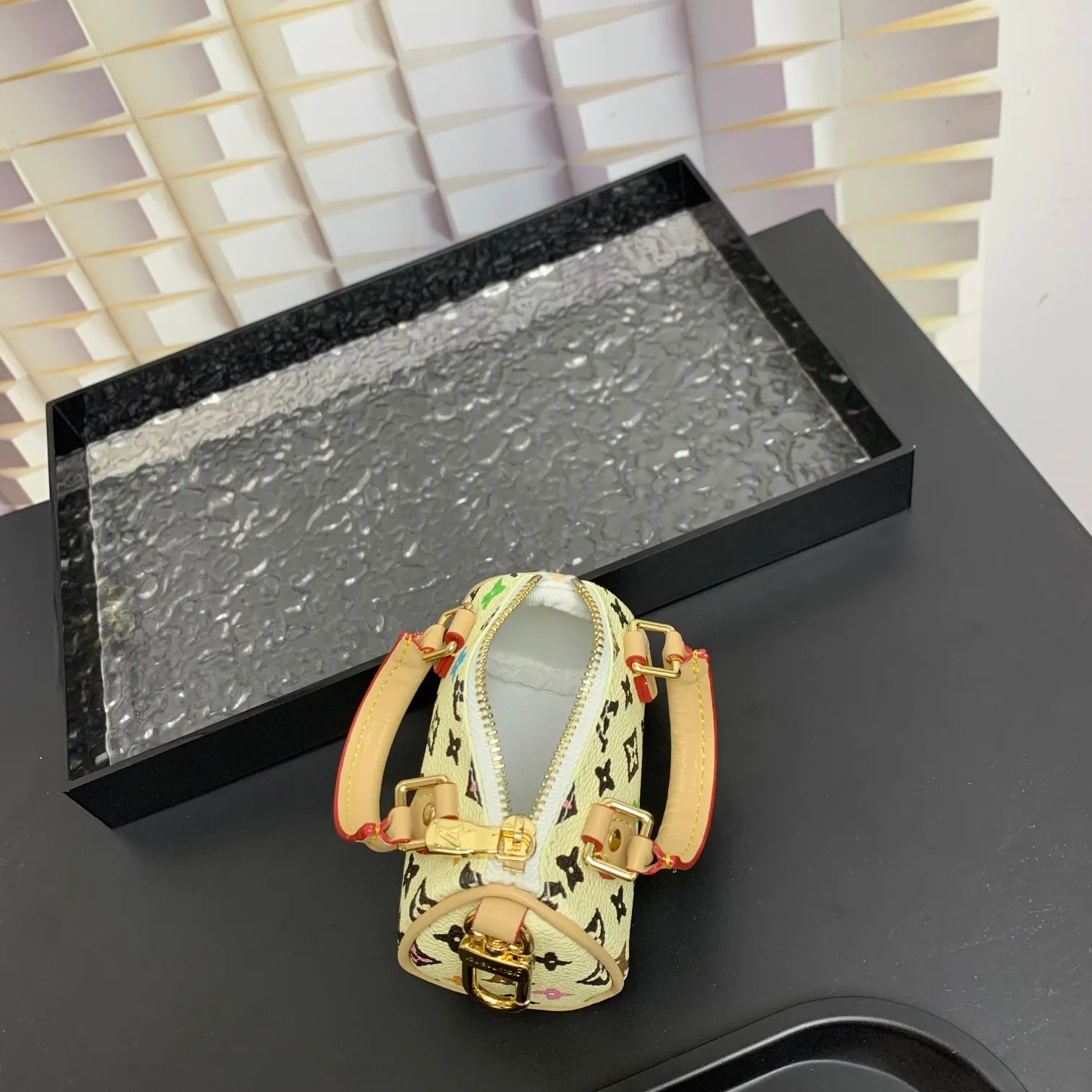 💰200 shipped😍 MINI KEEPALL bag charm and keychain ☀️Louis Vuitton Louis Vuitton lv mini pillow bag pendant ☀️This Mini Keepall bag charm and keychain condenses the classic handbag configuration, boldly showing the spirit of adventure. Monogram canvas with LV inscribed hook buckle, whether hung on a belt or handbag, its zipper closure and built-in keychain ensure secure storage