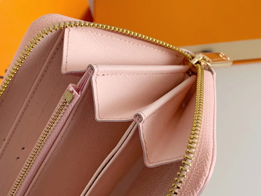 💰100 💎M60017 inner color ❤️white plaid pink ZIPPY zipper wallet. The Zippy wallet pays homage to Louis Vuitton's heritage of travel and trunk making, with a travel-style patch and Louis Vuitton logo. With its compact interior and simple design, this wallet is ideal for everyday use. Model M60017. Size: 19x10.