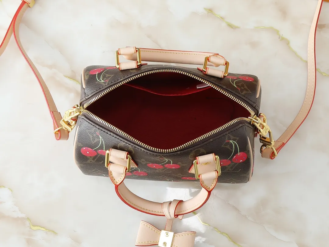 💰240💰Upgraded original M13094 M46234 This Speedy Bandoulière handbag is made of classic Monogram coated canvas, with the sweet cherry pattern of the Louis Vuitton x Murakami replica series to light up the trend. Crafted from premium leather, the Toron top handle, detachable shoulder strap and LV x TM key holder are compactly sized to easily hold everyday essentials such as a cell phone and a long wallet. Dimensions: 20.5 x 13.5 x 12.0 cm (length x height x width)