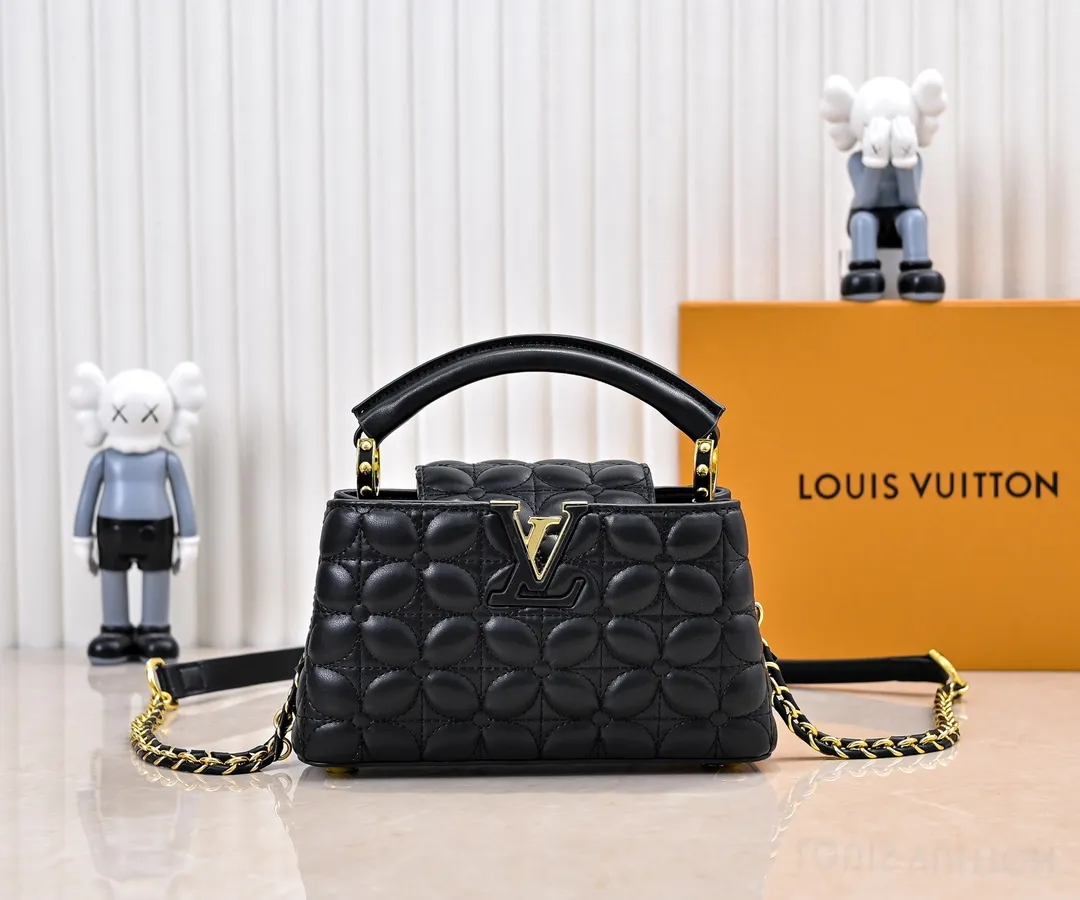 Upgraded version P420 M23998 Black This Monogram embroidered flower emerges from the elegant quilting, bringing the style of Louis Vuitton store decoration to the Capucines mini handbag. Soft sheepskin creates a stable structure and trim, and the detachable shoulder strap allows for comfortable shoulder or cross-body wear. Dimensions: 22 x 12 x 8 cm