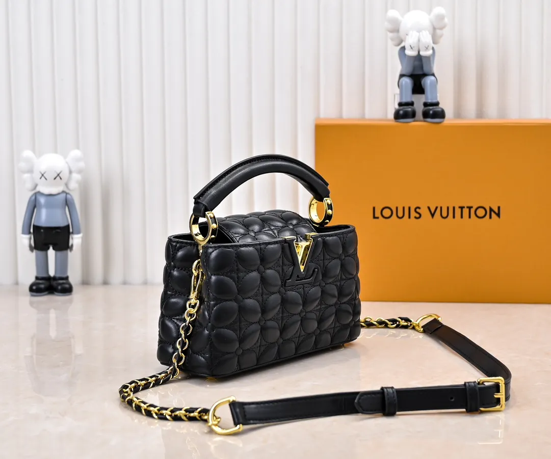 Upgraded version P420 M23998 Black This Monogram embroidered flower emerges from the elegant quilting, bringing the style of Louis Vuitton store decoration to the Capucines mini handbag. Soft sheepskin creates a stable structure and trim, and the detachable shoulder strap allows for comfortable shoulder or cross-body wear. Dimensions: 22 x 12 x 8 cm