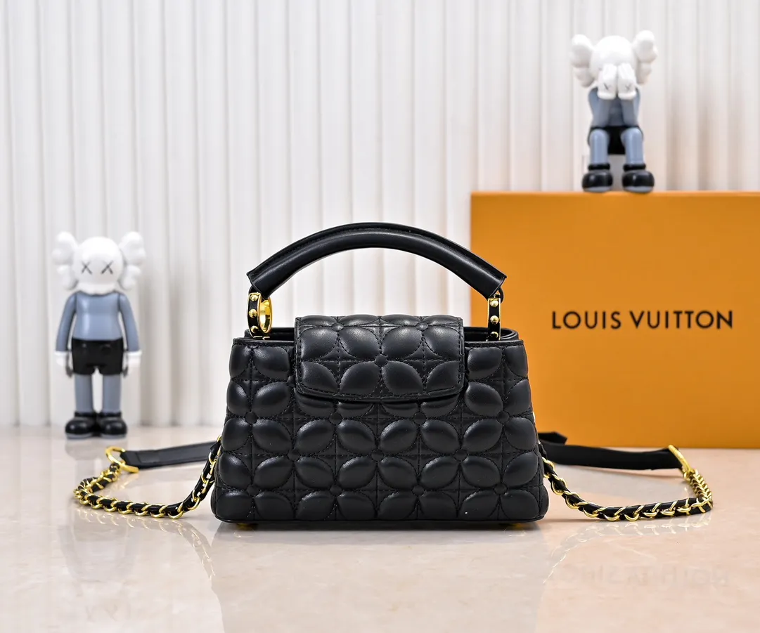 Upgraded version P420 M23998 Black This Monogram embroidered flower emerges from the elegant quilting, bringing the style of Louis Vuitton store decoration to the Capucines mini handbag. Soft sheepskin creates a stable structure and trim, and the detachable shoulder strap allows for comfortable shoulder or cross-body wear. Dimensions: 22 x 12 x 8 cm