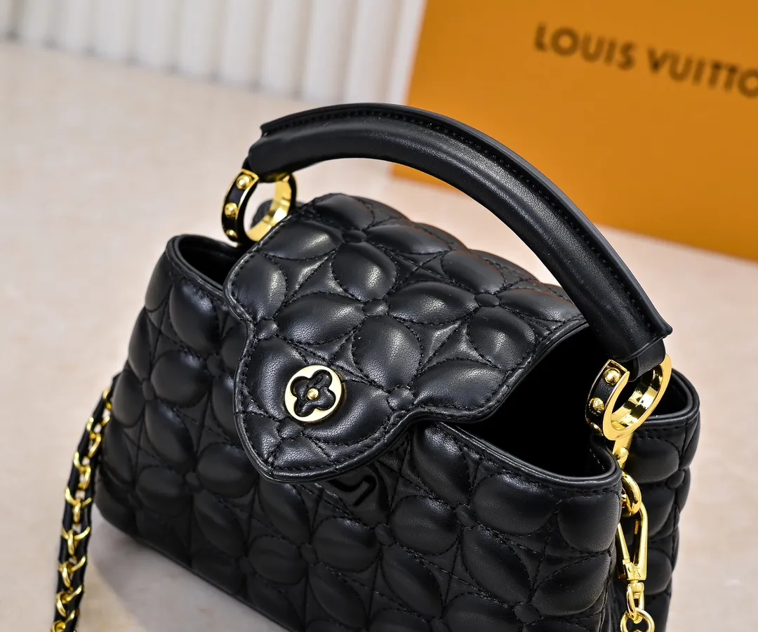 Upgraded version P420 M23998 Black This Monogram embroidered flower emerges from the elegant quilting, bringing the style of Louis Vuitton store decoration to the Capucines mini handbag. Soft sheepskin creates a stable structure and trim, and the detachable shoulder strap allows for comfortable shoulder or cross-body wear. Dimensions: 22 x 12 x 8 cm