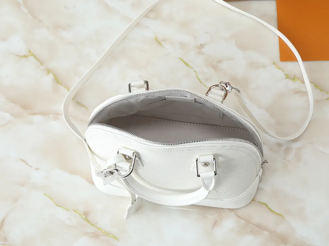 💰240💰Upgraded original M41160 M41327 M40855 M40862 M53152 This Alma BB handbag is based on a classic Louis Vuitton bag designed in 1934 with an Art Deco style. In 2010, on the occasion of the 20th anniversary of the official launch of the Alma bag, a mini model was specially designed for the daughter of the woman who owns this bag. The Alma BB bag features a removable shoulder strap for lightweight cross-body wear. A new and stylish take on a classic shape, this bag in Epi leather is available in a range of bright, vibrant colors. Size: 25×19×12cm