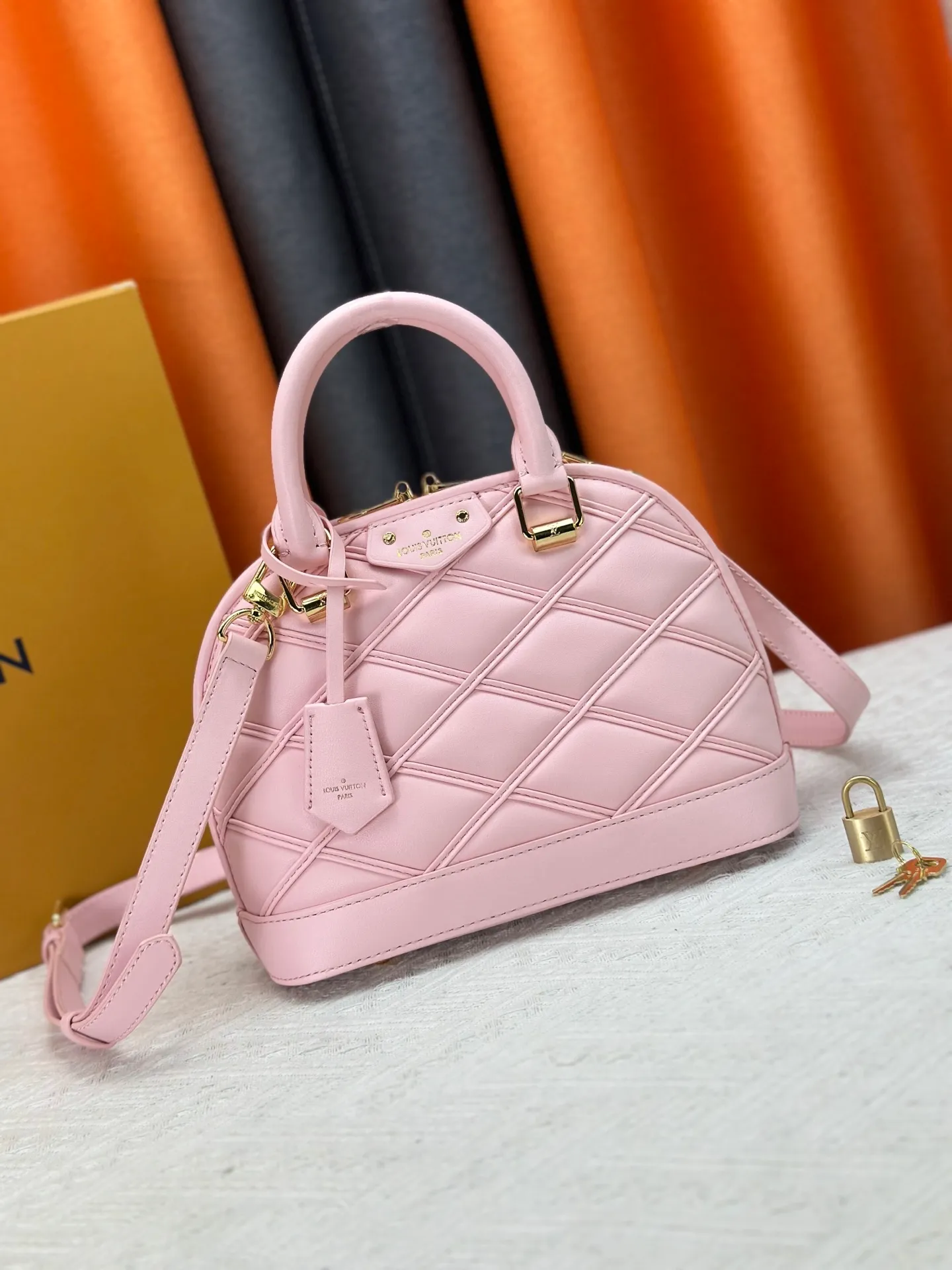 P360 M83048 M53152 This Nano Alma handbag is a pocket-sized version of Louis Vuitton's classic Alma handbag. It is made of soft lambskin with a Malletage quilting pattern, recalling the diamond inner panel of the brand's traditional hard luggage. The elegant handle, dazzling chain and detachable and adjustable leather shoulder strap enable a variety of carrying styles. Dimensions: 23.5x17.5x11.5cm
