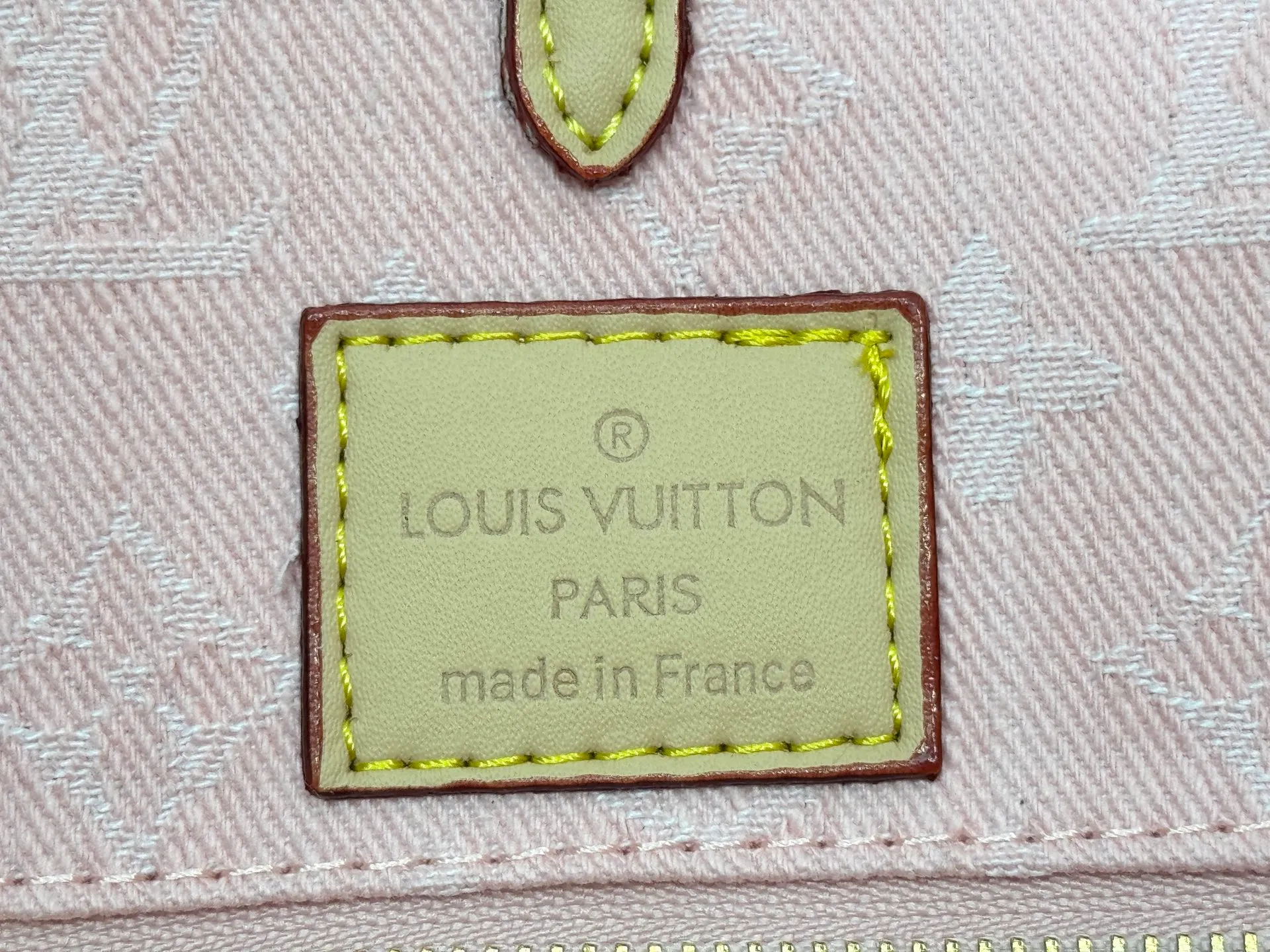 P320 M49495 M45659 M13189 New Gray Denim Denim This edition of OnTheGo MM celebrates the return of the iconic Monogram denim pattern in 2005. It's made from organic cotton, artfully woven with black and white threads and then bleached using a special Louis Vuitton technique to create a vintage-inspired finish. It's sized to hold a laptop, features light gold hardware, and includes signature details like natural leather accents and a removable name tag. Dimensions: 35 x 27 x 14 cm
