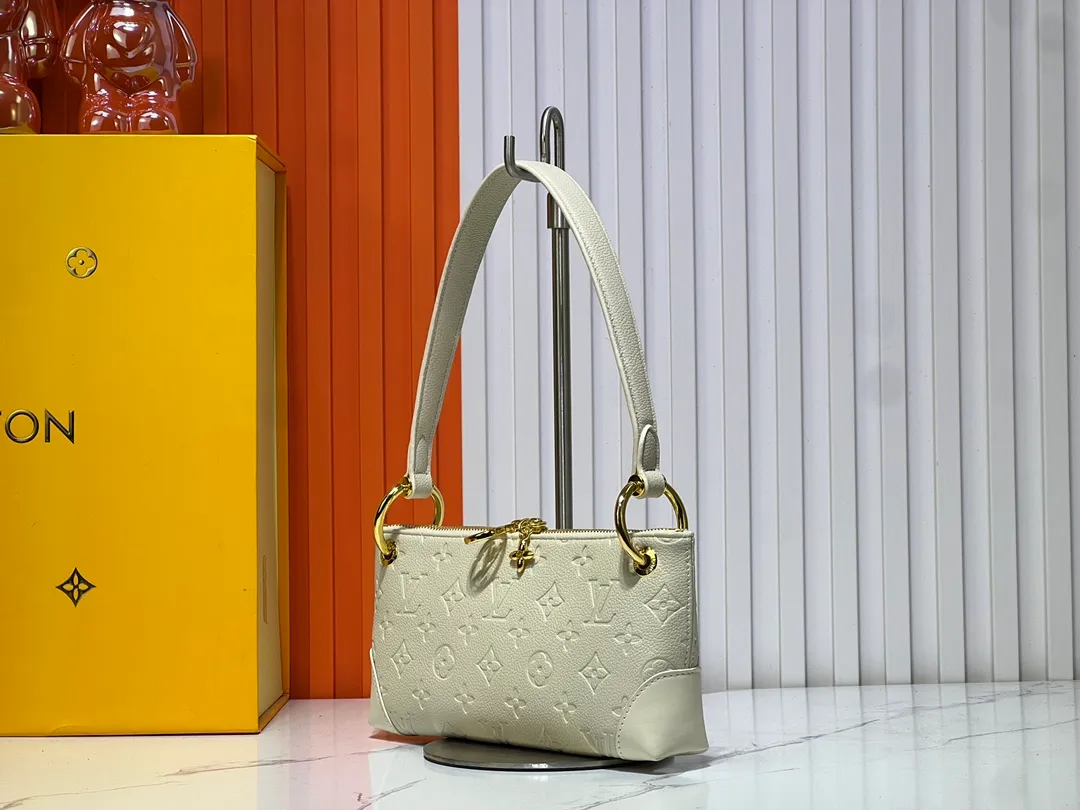 Batch 220💰Upgraded original M12174 This Pochette Sèvres belongs to the LV ski collection and is ready to shine in a "shiny" gun metal tone. It's crafted from signature Monogram Empreinte leather with pale gold hardware for an elegant contrast. The double zip closure features two pendants, one depicting an LV ring and the other displaying a crystal-embellished Monogram flower. Think of it as the perfect après-ski bag. Dimensions: 25 x 13 x 5 cm (length x height x width)
