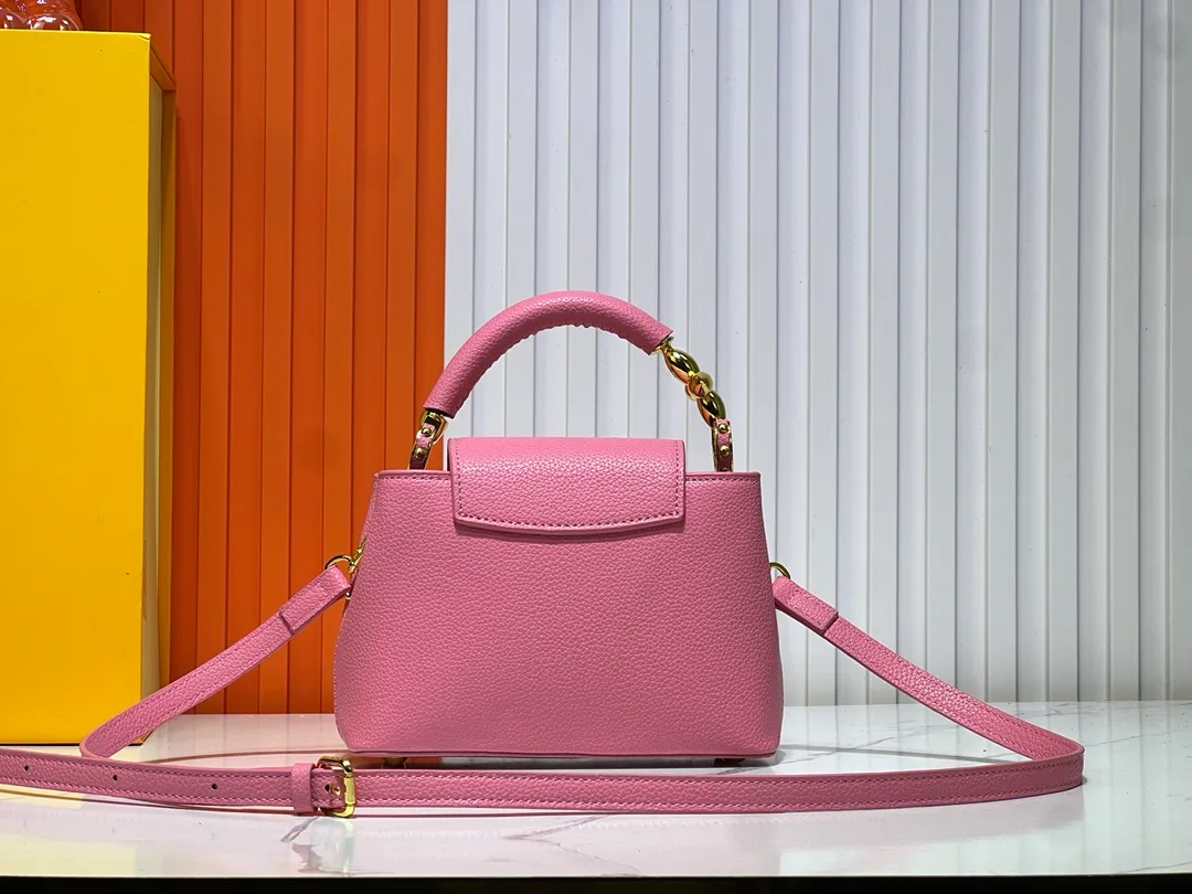 Batch 360💰Upgraded original M23943 M23944 M23945 M24698 M24989 This Capucines mini handbag incorporates exquisite Monogram flowers on the handle, presenting the three-dimensional look of the LV logo with delicate brushstrokes, injecting dazzling luster into the soft design. Full-grain Taurillon leather is designed to fit a smartphone, short wallet and other small essentials. Dimensions: Small 21.0 x 14.0 x 8.0 cm (L x H x W) Large 27x 17.5 x 9.0 cm (L x H x W)