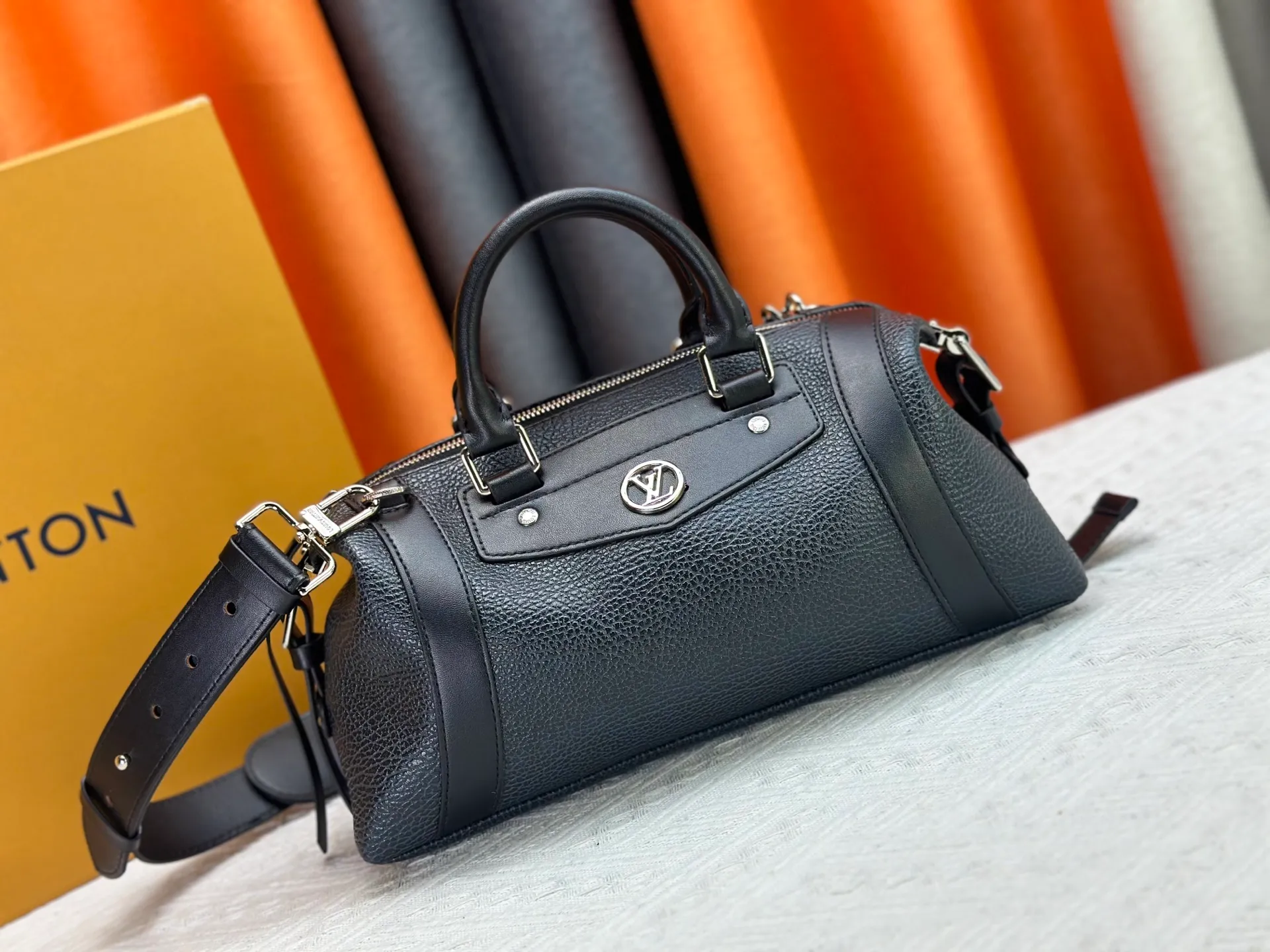 P300 small P320 medium P340 large M25557 M25561 M25561 M25566 Black M14623 mini M14514 small M14700 medium Dark gray M14702 medium Light gray M14721 small This Nano LV Rider handbag is from 2025 For the spring and summer series, pixelated grained sheep leather is blended with smooth cow leather elements, and the LV Circle logo is highlighted with elegant patches. The foldable configuration makes it easy to store in a suitcase, and the modern design adds a rock-n-roll edge to any look.  Mini 10 x 10 x 23 cm Small 12 × 12 × 30 cm Medium 15 × 15 × 38 cm (H x W x L) Sheep leather Cow leather trim Textile lining Metal hardware Zipper closure Side slip straps Internal pocket Holds a 6.7-inch smartphone, Romy card holder and lipstick Shoulder strap: removable, adjustable Strap half-length: 30.0 cm Bag strap half length adjustable to: 45.0 cm Handle: double handle