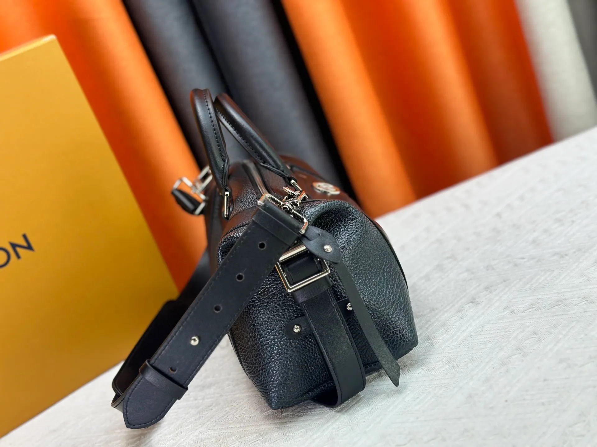 P300 small P320 medium P340 large M25557 M25561 M25561 M25566 Black M14623 mini M14514 small M14700 medium Dark gray M14702 medium Light gray M14721 small This Nano LV Rider handbag is from 2025 For the spring and summer series, pixelated grained sheep leather is blended with smooth cow leather elements, and the LV Circle logo is highlighted with elegant patches. The foldable configuration makes it easy to store in a suitcase, and the modern design adds a rock-n-roll edge to any look.  Mini 10 x 10 x 23 cm Small 12 × 12 × 30 cm Medium 15 × 15 × 38 cm (H x W x L) Sheep leather Cow leather trim Textile lining Metal hardware Zipper closure Side slip straps Internal pocket Holds a 6.7-inch smartphone, Romy card holder and lipstick Shoulder strap: removable, adjustable Strap half-length: 30.0 cm Bag strap half length adjustable to: 45.0 cm Handle: double handle