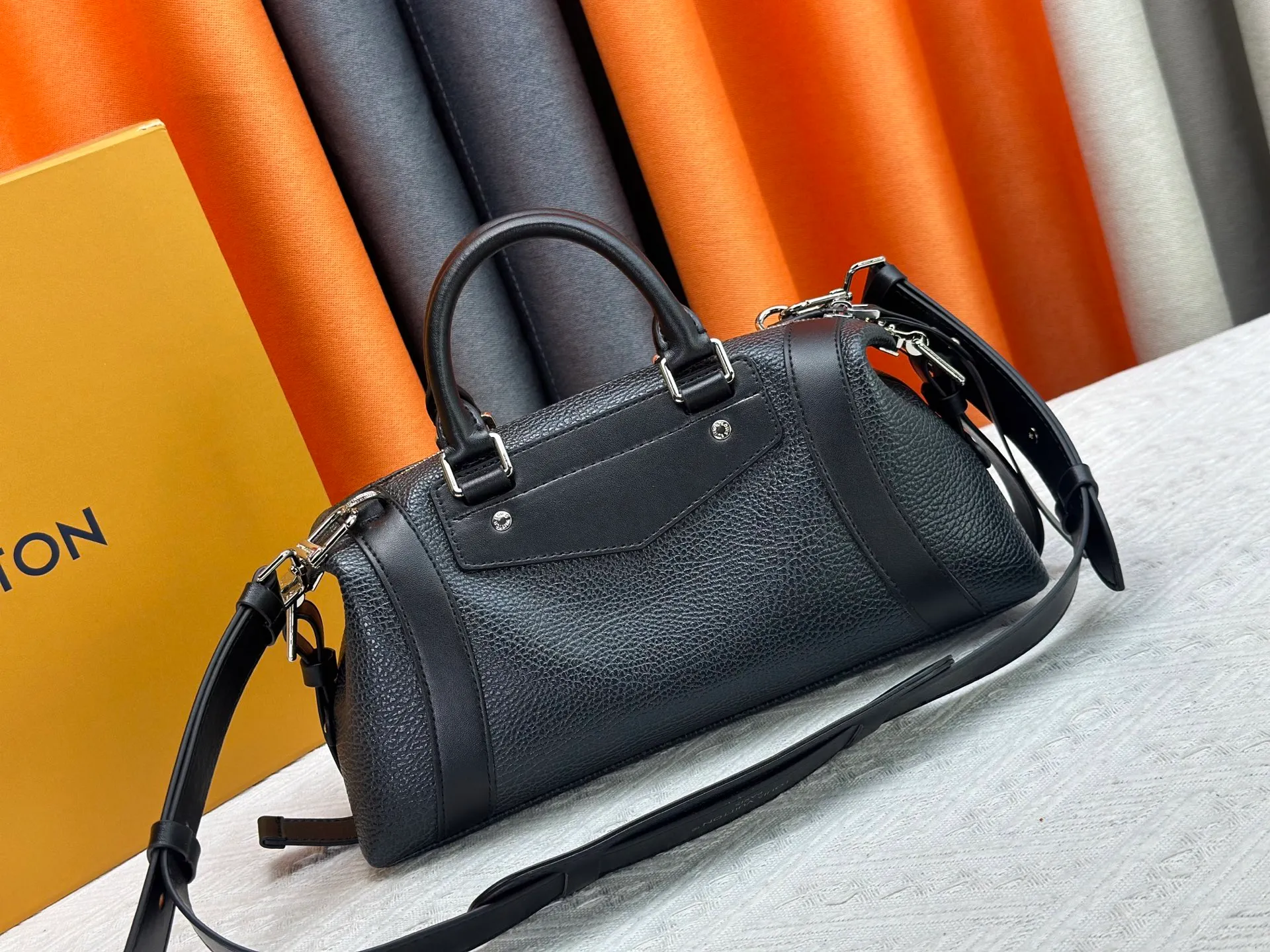 P300 small P320 medium P340 large M25557 M25561 M25561 M25566 Black M14623 mini M14514 small M14700 medium Dark gray M14702 medium Light gray M14721 small This Nano LV Rider handbag is from 2025 For the spring and summer series, pixelated grained sheep leather is blended with smooth cow leather elements, and the LV Circle logo is highlighted with elegant patches. The foldable configuration makes it easy to store in a suitcase, and the modern design adds a rock-n-roll edge to any look.  Mini 10 x 10 x 23 cm Small 12 × 12 × 30 cm Medium 15 × 15 × 38 cm (H x W x L) Sheep leather Cow leather trim Textile lining Metal hardware Zipper closure Side slip straps Internal pocket Holds a 6.7-inch smartphone, Romy card holder and lipstick Shoulder strap: removable, adjustable Strap half-length: 30.0 cm Bag strap half length adjustable to: 45.0 cm Handle: double handle