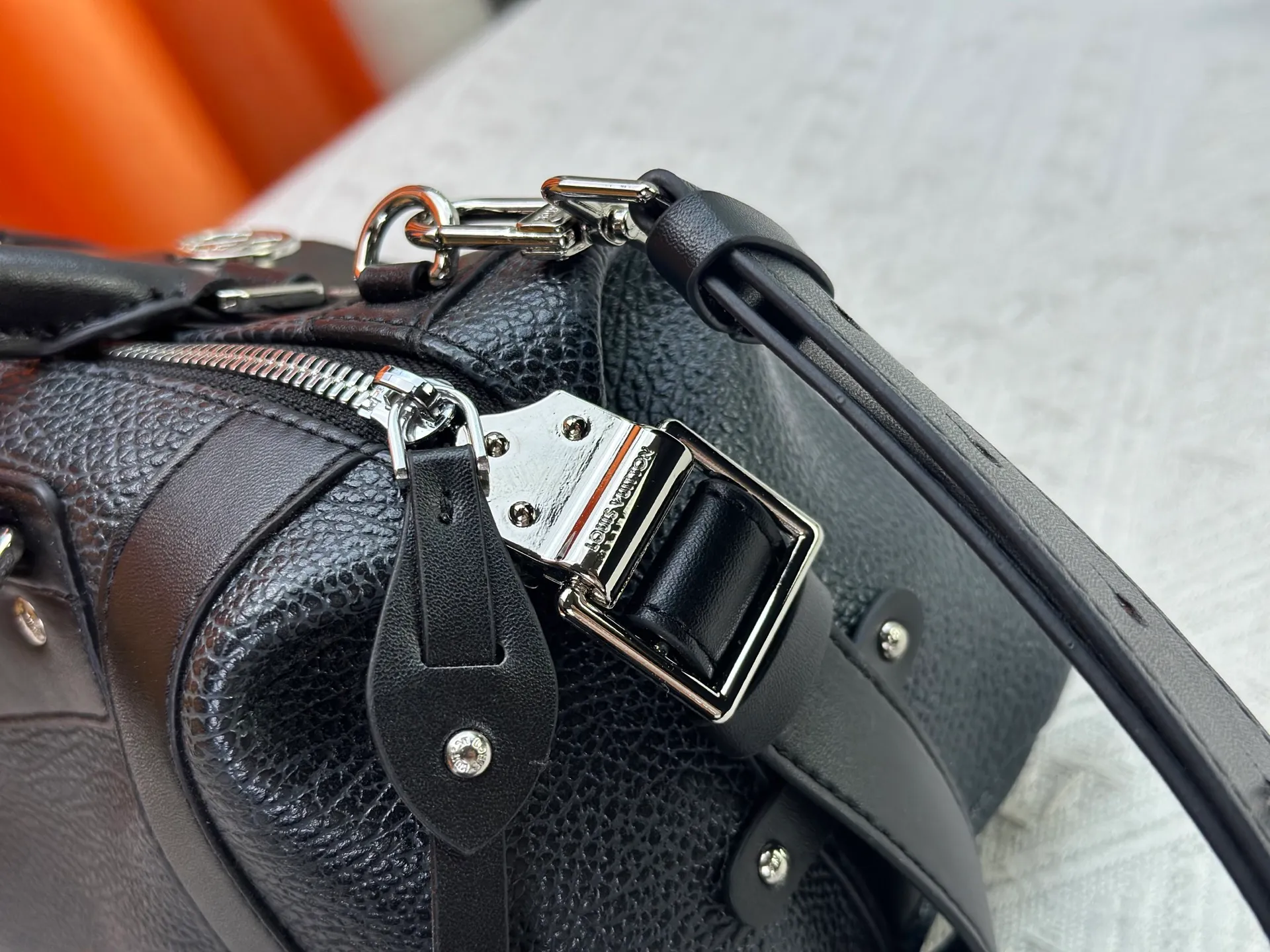 P300 small P320 medium P340 large M25557 M25561 M25561 M25566 Black M14623 mini M14514 small M14700 medium Dark gray M14702 medium Light gray M14721 small This Nano LV Rider handbag is from 2025 For the spring and summer series, pixelated grained sheep leather is blended with smooth cow leather elements, and the LV Circle logo is highlighted with elegant patches. The foldable configuration makes it easy to store in a suitcase, and the modern design adds a rock-n-roll edge to any look.  Mini 10 x 10 x 23 cm Small 12 × 12 × 30 cm Medium 15 × 15 × 38 cm (H x W x L) Sheep leather Cow leather trim Textile lining Metal hardware Zipper closure Side slip straps Internal pocket Holds a 6.7-inch smartphone, Romy card holder and lipstick Shoulder strap: removable, adjustable Strap half-length: 30.0 cm Bag strap half length adjustable to: 45.0 cm Handle: double handle