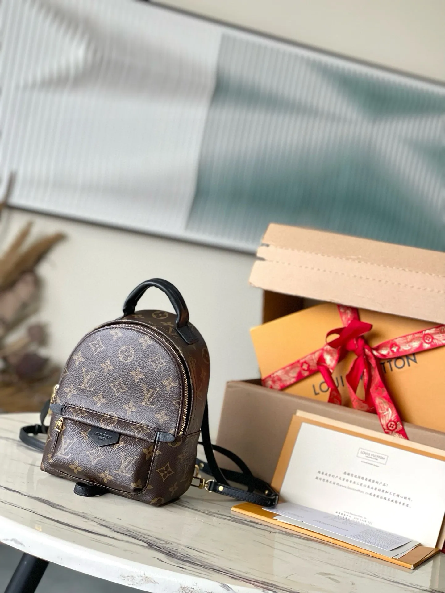 💰720 Top original M44873 presbyopic mini backpack.  Nicolas Ghesquière gives this backpack an astonishing style change, transforming a simple daily necessities into a fashionable and extremely charming urban bag. This mini backpack made of soft Monogram canvas is petite and cute, and has multi-purpose straps for easy cross-body wear. Monogram coated canvas material - Soft calfskin trim, foam backing - Padded leather top handles - Pair of adjustable shoulder straps - Nylon lining - Gold-tone hardware - Engraved zipper puller - Zippered front pocket on the outside of the bag - Flat inner pocket ✈️Size: 16X20X9cm
