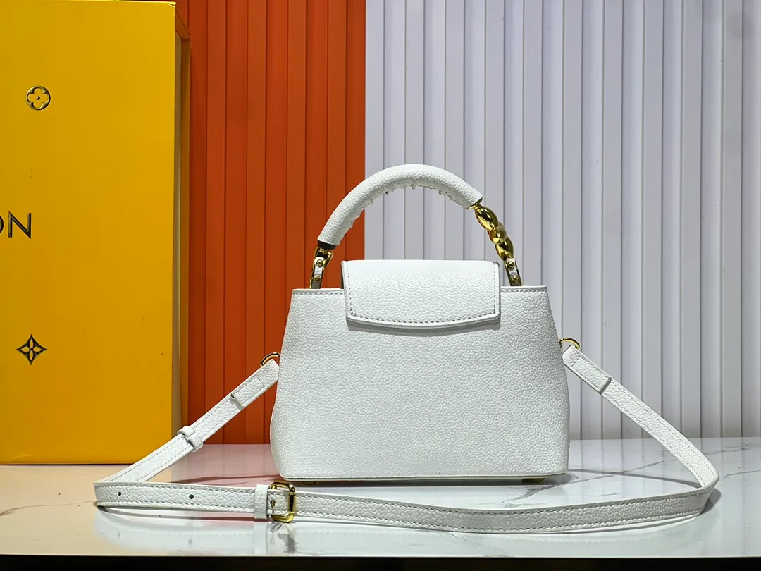 Batch 360💰Upgraded original M23943 M23944 M23945 M24698 M24989 This Capucines mini handbag incorporates exquisite Monogram flowers on the handle, presenting the three-dimensional look of the LV logo with delicate brushstrokes, injecting dazzling luster into the soft design. Full-grain Taurillon leather is designed to fit a smartphone, short wallet and other small essentials. Dimensions: Small 21.0 x 14.0 x 8.0 cm (L x H x W) Large 27x 17.5 x 9.0 cm (L x H x W)