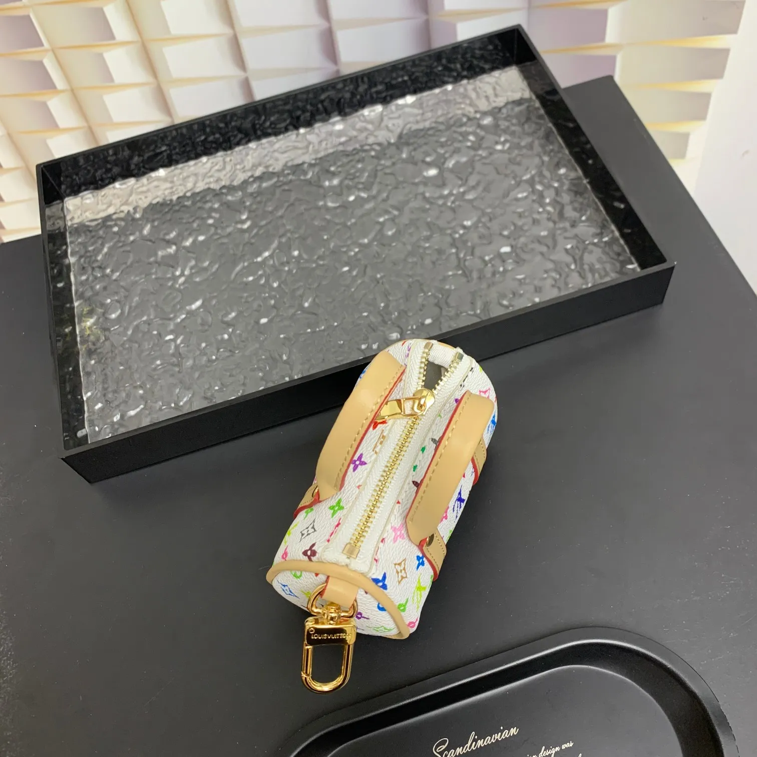 💰200 shipped😍 MINI KEEPALL bag charm and keychain ☀️Louis Vuitton Louis Vuitton lv mini pillow bag pendant ☀️This Mini Keepall bag charm and keychain condenses the classic handbag configuration, boldly showing the spirit of adventure. Monogram canvas with LV inscribed hook buckle, whether hung on a belt or handbag, its zipper closure and built-in keychain ensure secure storage