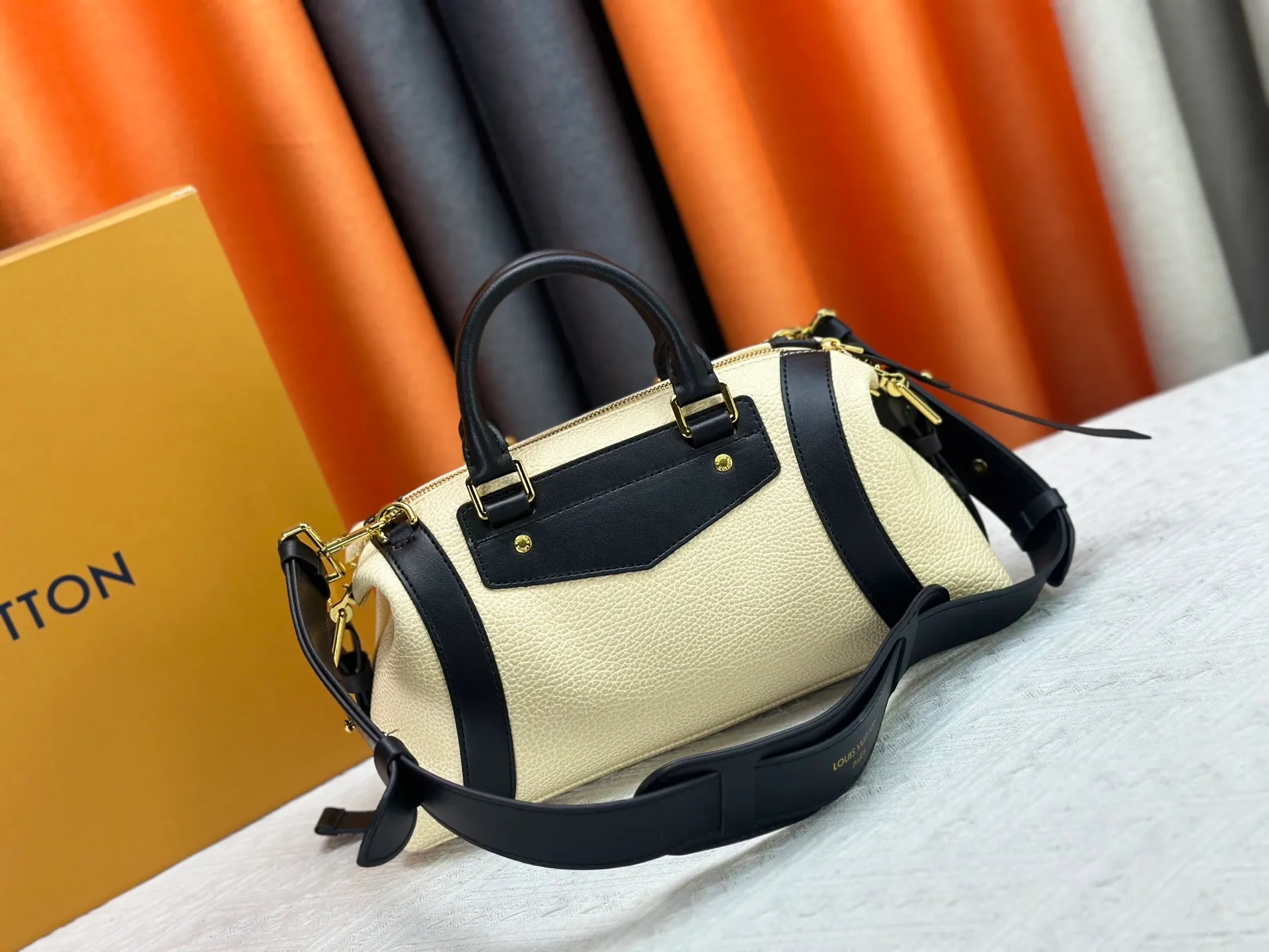 P300 small P320 medium P340 large M25557 M25561 M25561 M25566 Black M14623 mini M14514 small M14700 medium Dark gray M14702 medium Light gray M14721 small This Nano LV Rider handbag is from 2025 For the spring and summer series, pixelated grained sheep leather is blended with smooth cow leather elements, and the LV Circle logo is highlighted with elegant patches. The foldable configuration makes it easy to store in a suitcase, and the modern design adds a rock-n-roll edge to any look.  Mini 10 x 10 x 23 cm Small 12 × 12 × 30 cm Medium 15 × 15 × 38 cm (H x W x L) Sheep leather Cow leather trim Textile lining Metal hardware Zipper closure Side slip straps Internal pocket Holds a 6.7-inch smartphone, Romy card holder and lipstick Shoulder strap: removable, adjustable Strap half-length: 30.0 cm Bag strap half length adjustable to: 45.0 cm Handle: double handle