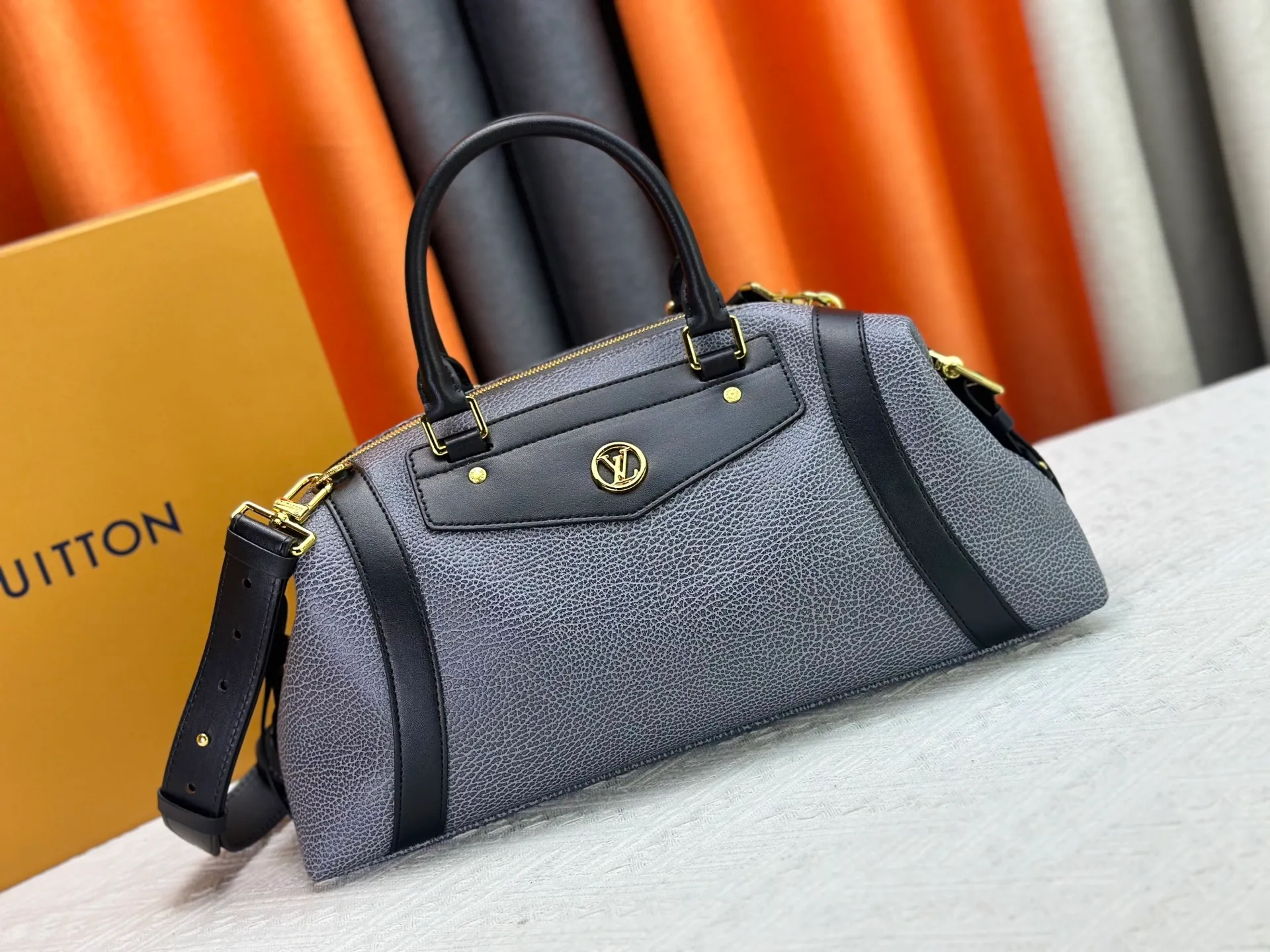 P300 small P320 medium P340 large M25557 M25561 M25561 M25566 Black M14623 mini M14514 small M14700 medium Dark gray M14702 medium Light gray M14721 small This Nano LV Rider handbag is from 2025 For the spring and summer series, pixelated grained sheep leather is blended with smooth cow leather elements, and the LV Circle logo is highlighted with elegant patches. The foldable configuration makes it easy to store in a suitcase, and the modern design adds a rock-n-roll edge to any look.  Mini 10 x 10 x 23 cm Small 12 × 12 × 30 cm Medium 15 × 15 × 38 cm (H x W x L) Sheep leather Cow leather trim Textile lining Metal hardware Zipper closure Side slip straps Internal pocket Holds a 6.7-inch smartphone, Romy card holder and lipstick Shoulder strap: removable, adjustable Strap half-length: 30.0 cm Bag strap half length adjustable to: 45.0 cm Handle: double handle