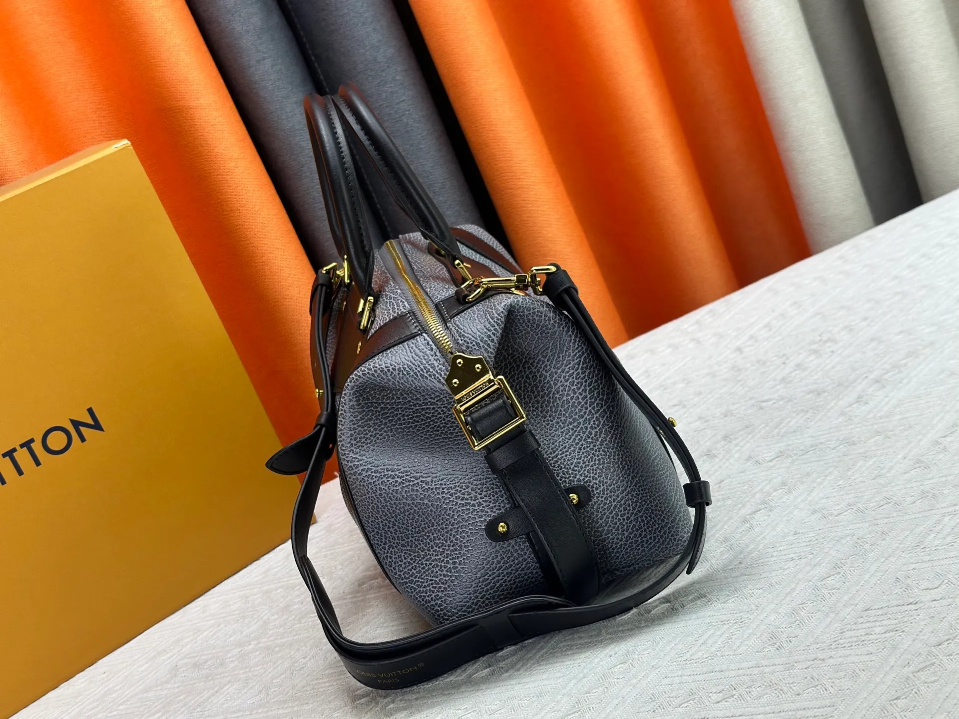 P300 small P320 medium P340 large M25557 M25561 M25561 M25566 Black M14623 mini M14514 small M14700 medium Dark gray M14702 medium Light gray M14721 small This Nano LV Rider handbag is from 2025 For the spring and summer series, pixelated grained sheep leather is blended with smooth cow leather elements, and the LV Circle logo is highlighted with elegant patches. The foldable configuration makes it easy to store in a suitcase, and the modern design adds a rock-n-roll edge to any look.  Mini 10 x 10 x 23 cm Small 12 × 12 × 30 cm Medium 15 × 15 × 38 cm (H x W x L) Sheep leather Cow leather trim Textile lining Metal hardware Zipper closure Side slip straps Internal pocket Holds a 6.7-inch smartphone, Romy card holder and lipstick Shoulder strap: removable, adjustable Strap half-length: 30.0 cm Bag strap half length adjustable to: 45.0 cm Handle: double handle
