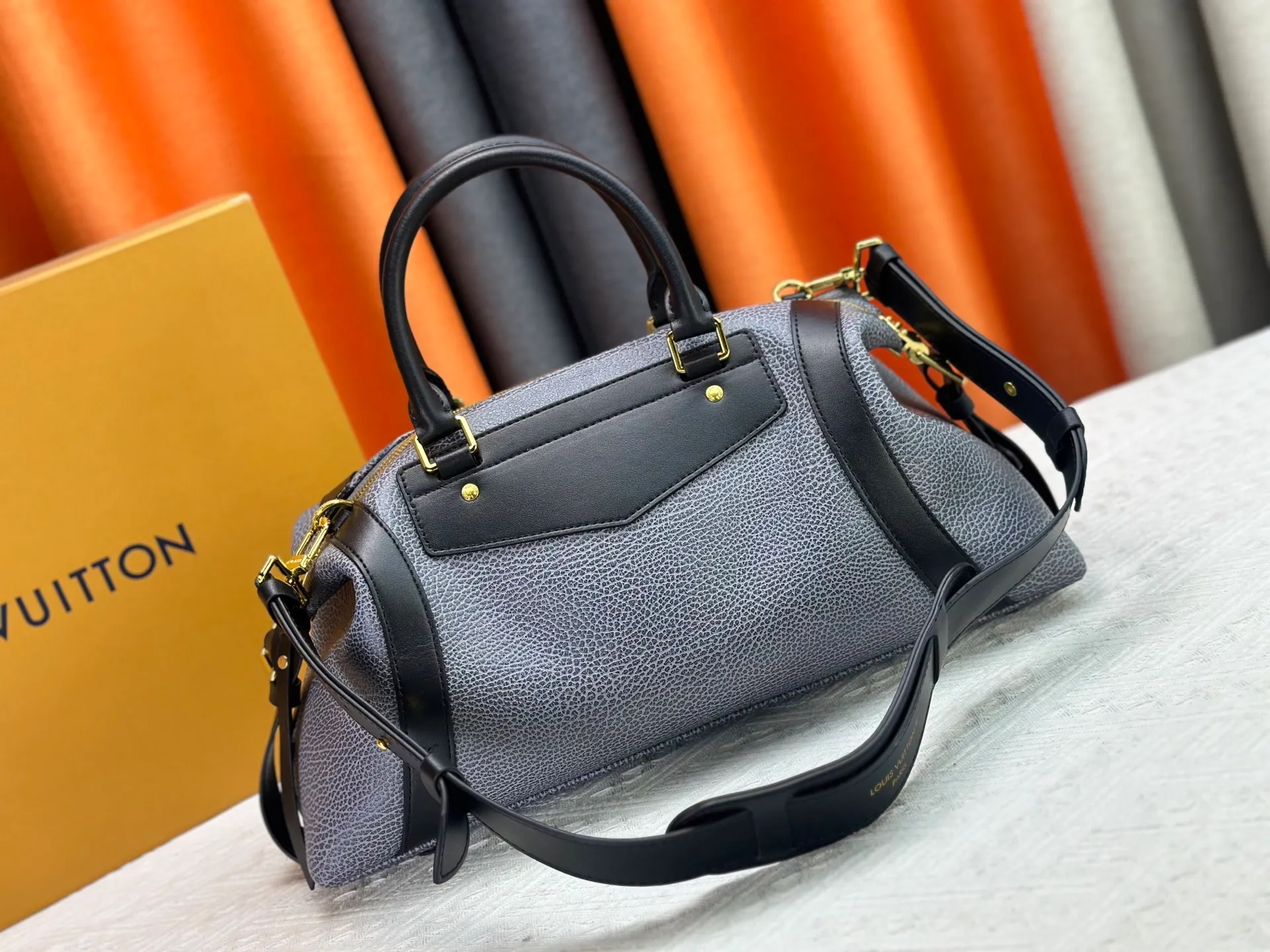 P300 small P320 medium P340 large M25557 M25561 M25561 M25566 Black M14623 mini M14514 small M14700 medium Dark gray M14702 medium Light gray M14721 small This Nano LV Rider handbag is from 2025 For the spring and summer series, pixelated grained sheep leather is blended with smooth cow leather elements, and the LV Circle logo is highlighted with elegant patches. The foldable configuration makes it easy to store in a suitcase, and the modern design adds a rock-n-roll edge to any look.  Mini 10 x 10 x 23 cm Small 12 × 12 × 30 cm Medium 15 × 15 × 38 cm (H x W x L) Sheep leather Cow leather trim Textile lining Metal hardware Zipper closure Side slip straps Internal pocket Holds a 6.7-inch smartphone, Romy card holder and lipstick Shoulder strap: removable, adjustable Strap half-length: 30.0 cm Bag strap half length adjustable to: 45.0 cm Handle: double handle