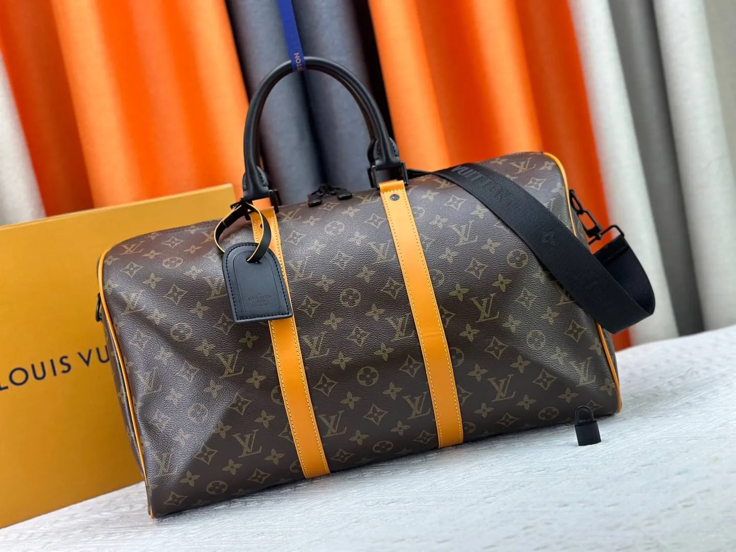 P360 M46703 M41416 This Keepall Bandoulière 45 travel bag introduces classic heritage in Monogram Macassar coated canvas. Side straps are cut out of contrasting leather, leather handles and hardware at the top add a calming touch, and the detachable and adjustable fabric shoulder strap is woven with the Louis Vuitton logo. Dimensions: 45 x 27 x 20 cm (Length x Height x Width) - Monogram Macassar coated canvas - Cow leather trim - Textile lining - Metal hardware - Carry-on baggage dimensions - Double zip closure - Padlock - Internal zip pocket - Removable name tag - Shoulder strap: removable, adjustable - Handles: Double handles - This product is made in one of France, Spain, Italy and the United States