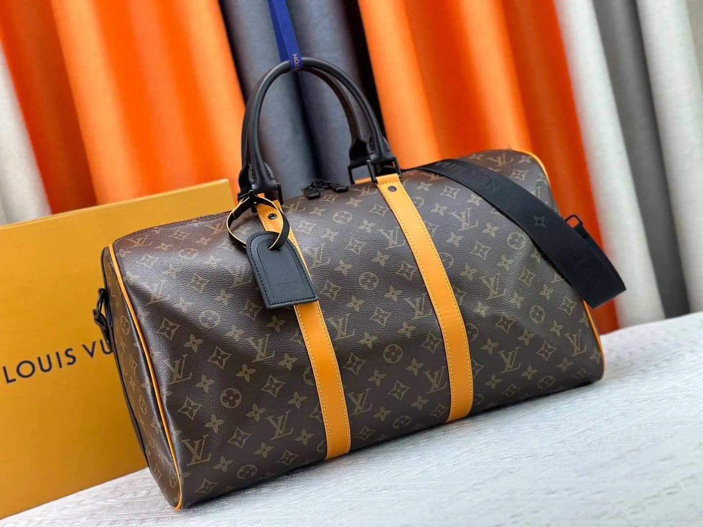 P360 M46703 M41416 This Keepall Bandoulière 45 travel bag introduces classic heritage in Monogram Macassar coated canvas. Side straps are cut out of contrasting leather, leather handles and hardware at the top add a calming touch, and the detachable and adjustable fabric shoulder strap is woven with the Louis Vuitton logo. Dimensions: 45 x 27 x 20 cm (Length x Height x Width) - Monogram Macassar coated canvas - Cow leather trim - Textile lining - Metal hardware - Carry-on baggage dimensions - Double zip closure - Padlock - Internal zip pocket - Removable name tag - Shoulder strap: removable, adjustable - Handles: Double handles - This product is made in one of France, Spain, Italy and the United States
