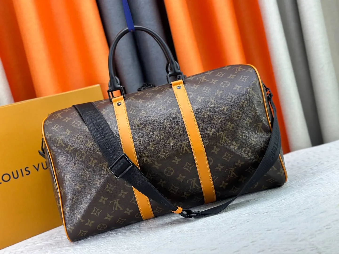 P360 M46703 M41416 This Keepall Bandoulière 45 travel bag introduces classic heritage in Monogram Macassar coated canvas. Side straps are cut out of contrasting leather, leather handles and hardware at the top add a calming touch, and the detachable and adjustable fabric shoulder strap is woven with the Louis Vuitton logo. Dimensions: 45 x 27 x 20 cm (Length x Height x Width) - Monogram Macassar coated canvas - Cow leather trim - Textile lining - Metal hardware - Carry-on baggage dimensions - Double zip closure - Padlock - Internal zip pocket - Removable name tag - Shoulder strap: removable, adjustable - Handles: Double handles - This product is made in one of France, Spain, Italy and the United States
