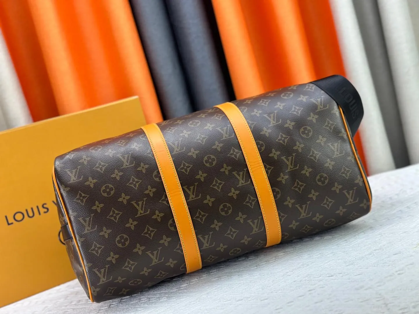 P360 M46703 M41416 This Keepall Bandoulière 45 travel bag introduces classic heritage in Monogram Macassar coated canvas. Side straps are cut out of contrasting leather, leather handles and hardware at the top add a calming touch, and the detachable and adjustable fabric shoulder strap is woven with the Louis Vuitton logo. Dimensions: 45 x 27 x 20 cm (Length x Height x Width) - Monogram Macassar coated canvas - Cow leather trim - Textile lining - Metal hardware - Carry-on baggage dimensions - Double zip closure - Padlock - Internal zip pocket - Removable name tag - Shoulder strap: removable, adjustable - Handles: Double handles - This product is made in one of France, Spain, Italy and the United States