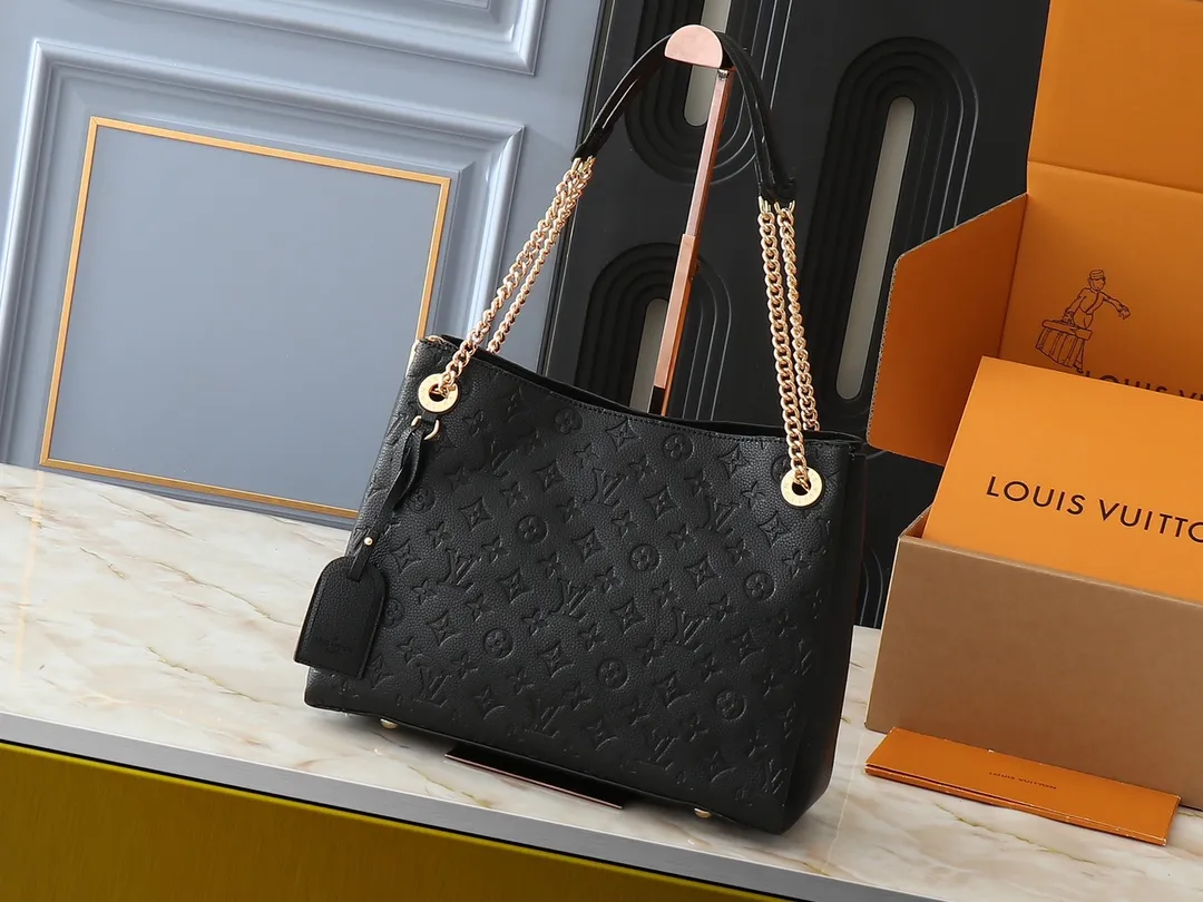 💰300💰Upgraded original M43772.M43759 M43758 This Surene MM Chain Handbag in Letter Empreinte Leather with its gold chain is as functional as it is sophisticated. Very easy to put on thanks to the leather shoulder pads and decorative chain. The large size of this suitcase means it easily fits A4 documents as well as all your daily essentials. The embossed pattern on supple leather is deep enough to stay in place for a while while still maintaining its soft feel. Size: length 37*26*15cm