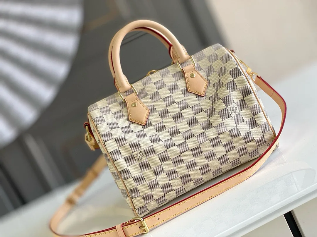 💰760 Top Original N41374 SPEEDY 25 Handbag (With Shoulder Strap) As a representative work of classic design, the Speedy 25 handbag shows full fashion sense whether it is carried cross-body, shoulder or handheld. Fresh and soft Damier Azur canvas adds a special touch. Detailed Features 25 x 19 x 15 cm (Length x Height x Width) Shiny gold-tone brass hardware and padlock Lockable double zipper closure Internal pocket D-ring for keys and accessories Soft fabric lining Shoulder strap: removable, adjustable Strap half-length: 46.5 cm Strap half-length adjustable to: 55.0 cm Handle: Double handle