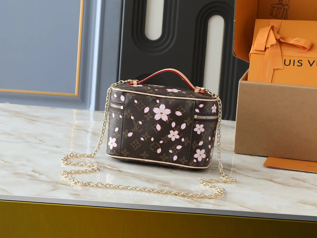 💰240💰Upgraded from the original M14181 M44495 M42265 M44936 M42263 This Nice mini cosmetic bag is made of Monogram coated canvas. The box-shaped outline is condensed with rounded strokes. The Cherry Blossom pattern releases the joyful atmosphere of the Louis Vuitton size：20x13.5x12cm