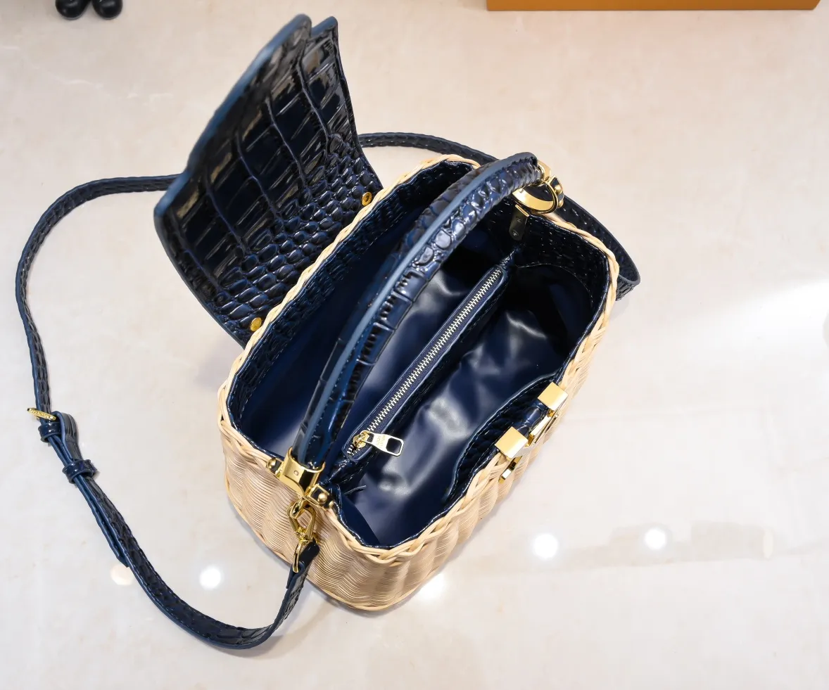 The upgraded version of P680 M11619 crocodile pattern CapucinesBB handbag has a unique rattan weaving structure, paying tribute to the Louis Vuitton picnic box design that came out in 1892. The cow leather shapes the top handle and flap, the LV letters reveal a metallic texture, and the detachable and adjustable leather shoulder strap makes it easy to carry on the shoulder. The gift box packaging provided with this product may be reasonably adjusted depending on the stock situation, and may be different from the packaging style displayed on this product page. Please refer to the actual gift box packaging style received for details. Size:27×17.3×9cm
