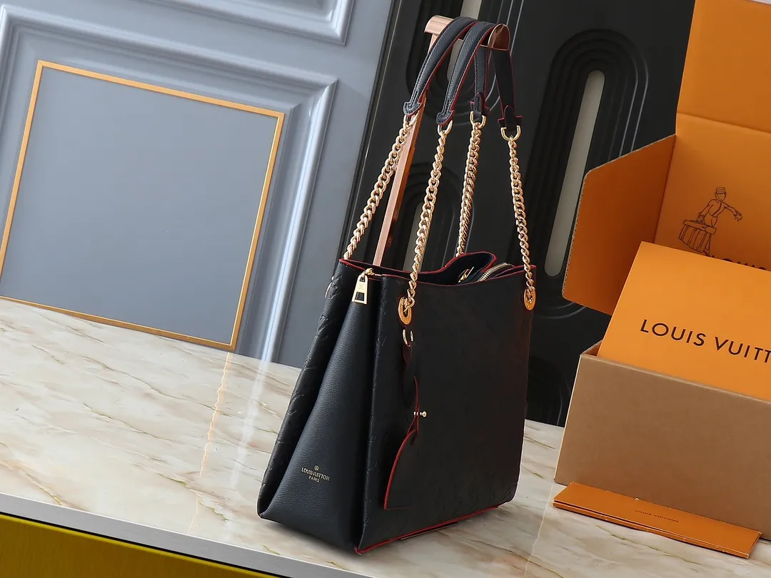 💰300💰Upgraded original M43772.M43759 M43758 This Surene MM Chain Handbag in Letter Empreinte Leather with its gold chain is as functional as it is sophisticated. Very easy to put on thanks to the leather shoulder pads and decorative chain. The large size of this suitcase means it easily fits A4 documents as well as all your daily essentials. The embossed pattern on supple leather is deep enough to stay in place for a while while still maintaining its soft feel. Size: length 37*26*15cm