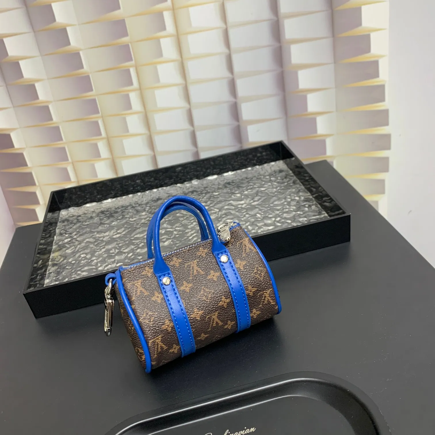 💰200 shipped😍 MINI KEEPALL bag charm and keychain ☀️Louis Vuitton Louis Vuitton lv mini pillow bag pendant ☀️This Mini Keepall bag charm and keychain condenses the classic handbag configuration, boldly showing the spirit of adventure. Monogram canvas with LV inscribed hook buckle, whether hung on a belt or handbag, its zipper closure and built-in keychain ensure secure storage