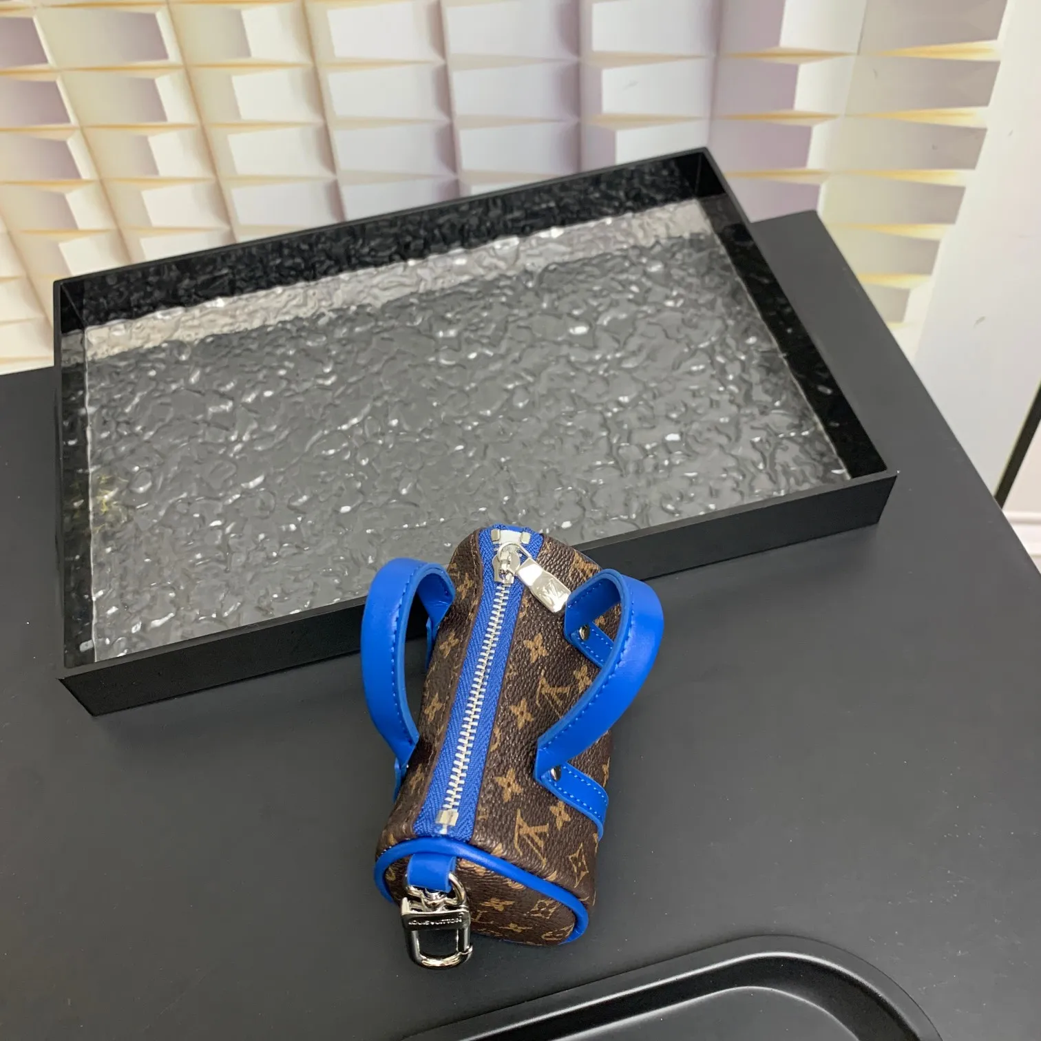 💰200 shipped😍 MINI KEEPALL bag charm and keychain ☀️Louis Vuitton Louis Vuitton lv mini pillow bag pendant ☀️This Mini Keepall bag charm and keychain condenses the classic handbag configuration, boldly showing the spirit of adventure. Monogram canvas with LV inscribed hook buckle, whether hung on a belt or handbag, its zipper closure and built-in keychain ensure secure storage