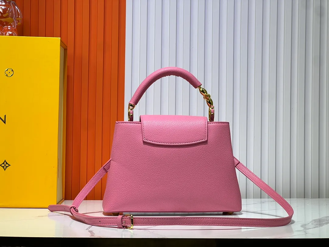 Batch 380💰Upgraded original M23943 M23944 M23945 M24698 M24989 This Capucines mini handbag incorporates exquisite Monogram flowers on the handle, presenting the three-dimensional look of the LV logo with delicate brushstrokes, injecting dazzling luster into the soft design. Full-grain Taurillon leather is designed to fit a smartphone, short wallet and other small essentials. Dimensions: Small 21.0 x 14.0 x 8.0 cm (L x H x W) Large 27x 17.5 x 9.0 cm (L x H x W)
