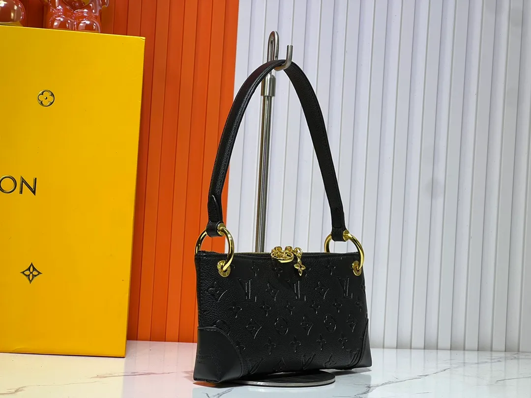 Batch 220💰Upgraded original M12174 This Pochette Sèvres belongs to the LV ski collection and is ready to shine in a "shiny" gun metal tone. It's crafted from signature Monogram Empreinte leather with pale gold hardware for an elegant contrast. The double zip closure features two pendants, one depicting an LV ring and the other displaying a crystal-embellished Monogram flower. Think of it as the perfect après-ski bag. Dimensions: 25 x 13 x 5 cm (length x height x width)