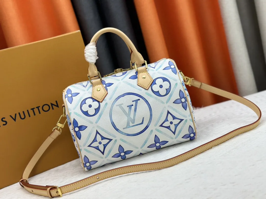 P260 M11264 This Speedy Bandoulière 25 handbag draws inspiration from the Speedy travel bag of the 1930s. It outlines the classic silhouette with Monogram Tiles canvas, giving it a fresh summer atmosphere. The print on the body and lining is reminiscent of Lisbon's beautiful tiles, and the LV Circle logo in the center adds to the brand's signature. 25.0 x 19.0 x 15.0 cm (L x H x W) • Monogram Tiles coated canvas • Cow leather trim • Printed fabric lining • Metal hardware • Double zip closure • Internal slip pocket • Padlock • Holds smartphone, keys, wallet, headphones and iPad Mini • Shoulder strap: removable, adjustable • Half-length strap: 46.5 cm • Half-length adjustable strap: 55.0 cm • Handle: Double handle