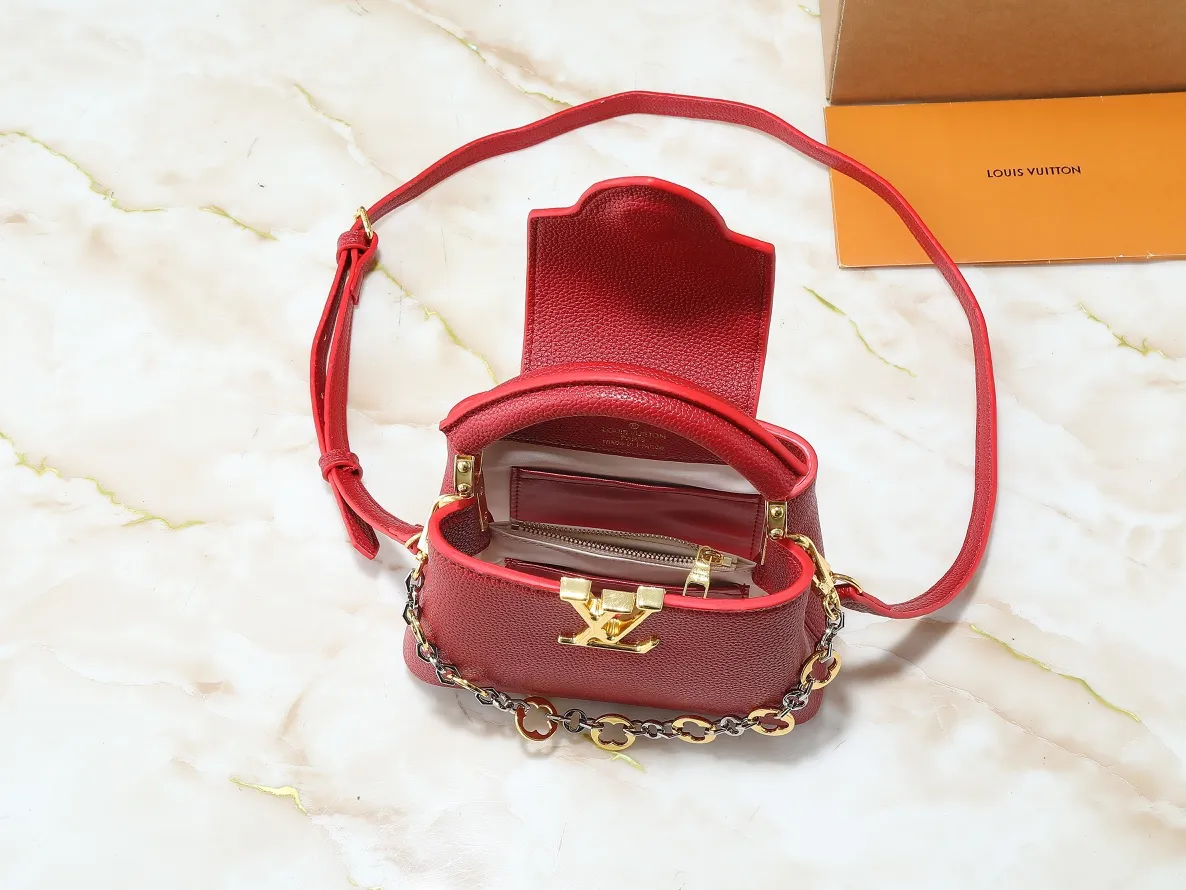 💰380💰Guangzhou goods Upgraded original M12935 M12936 M12937 M12938 This Capucines mini handbag is from the Capucines Chain On You series. It is made of soft Taurillon cow leather and has ample space to store daily necessities such as short wallets, keys, and lipstick. The jewelry-style double-plated chain features Monogram floral details that complement the rounded LV letters, and the flap can be tucked in or out. Dimensions: 21.0 x 14.0 x 8.0 cm (length x height x width)