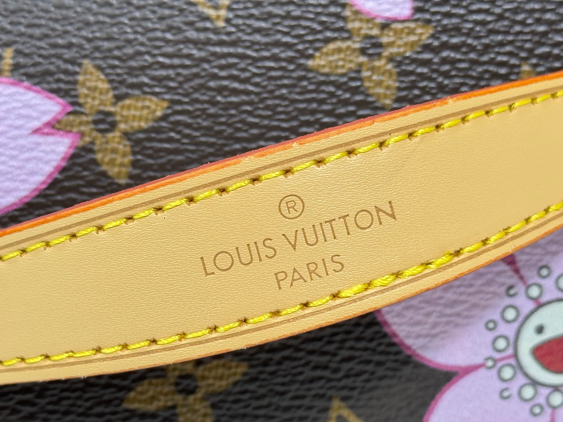P240 Upgraded original M14181 M44495 This Nice mini cosmetic bag is made of Monogram coated canvas. The box-shaped outline is condensed with rounded strokes. The Cherry Blossom pattern releases the joyful atmosphere of the Louis Vuitton