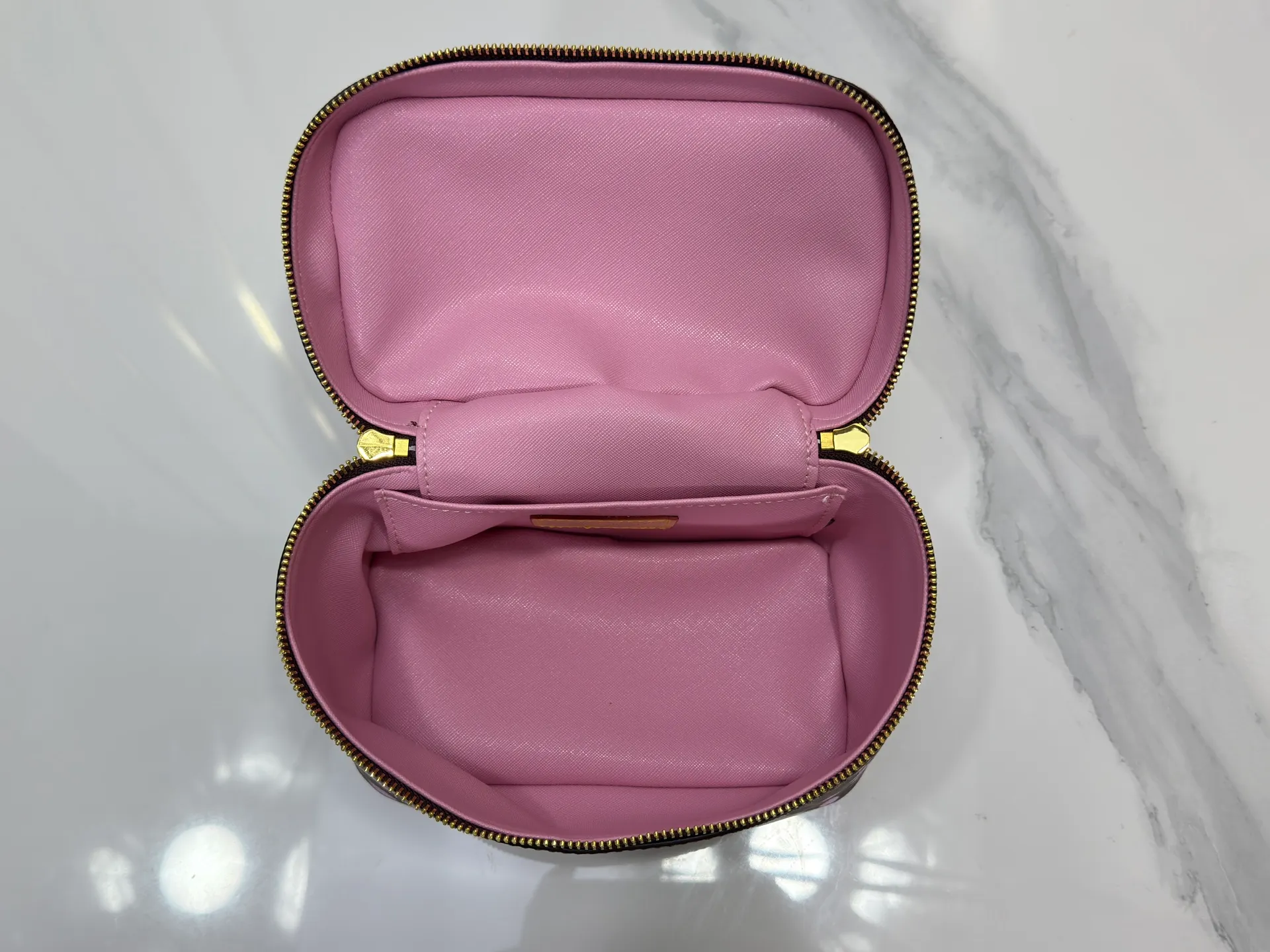 P240 Upgraded original M14181 M44495 This Nice mini cosmetic bag is made of Monogram coated canvas. The box-shaped outline is condensed with rounded strokes. The Cherry Blossom pattern releases the joyful atmosphere of the Louis Vuitton