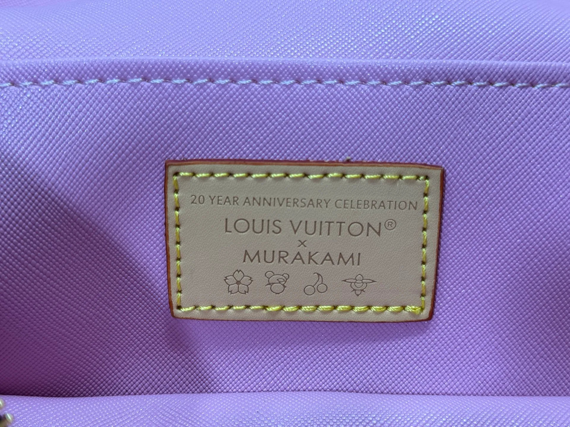 P240 Upgraded original M14181 M44495 This Nice mini cosmetic bag is made of Monogram coated canvas. The box-shaped outline is condensed with rounded strokes. The Cherry Blossom pattern releases the joyful atmosphere of the Louis Vuitton